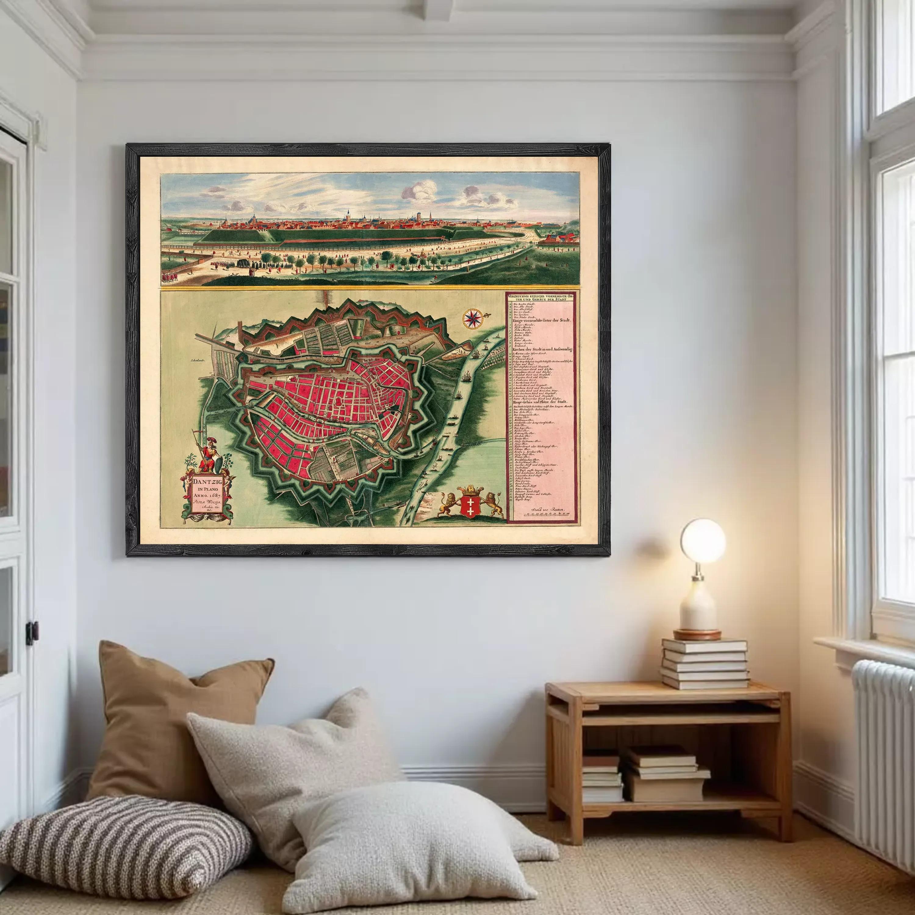 The image is a framed vintage map of a city, depicting a detailed layout of the city's streets, buildings, and surrounding landscape.
