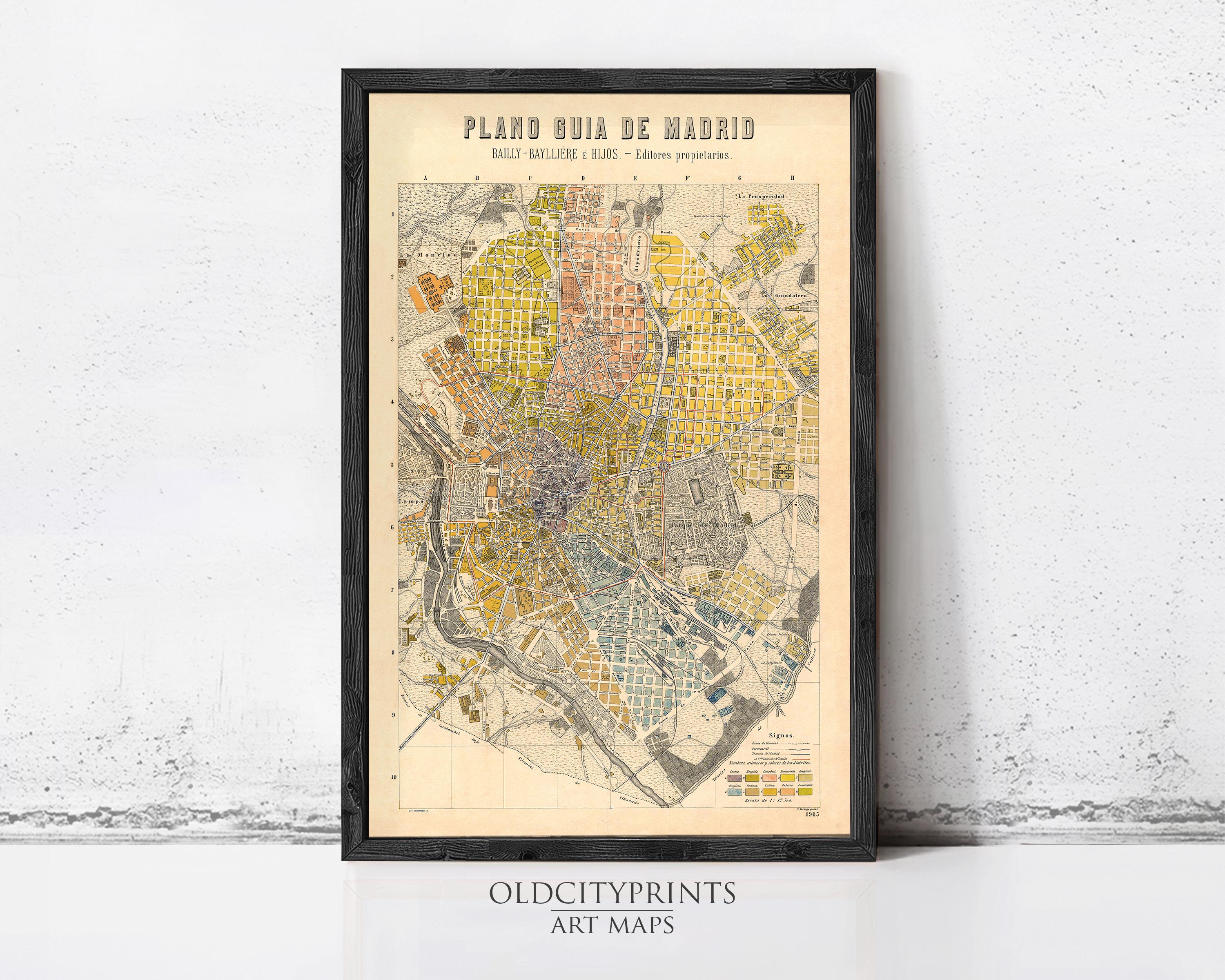 The image is a framed vintage map of Madrid, Spain, depicting the city's layout and various neighborhoods.