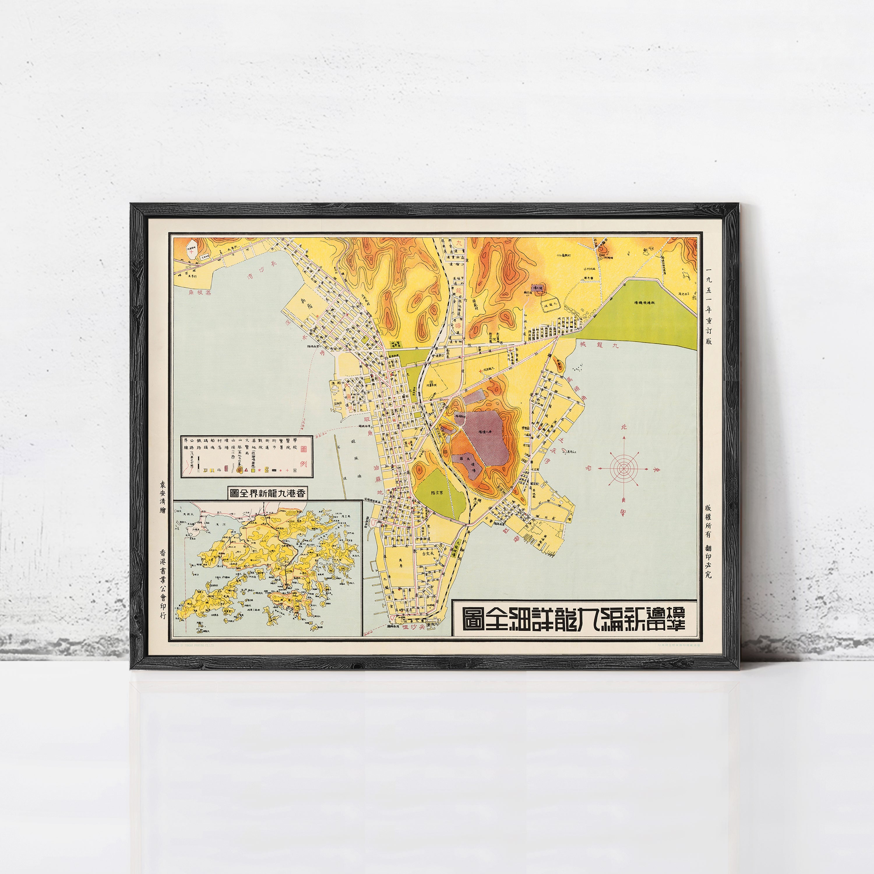 The image is a framed vintage map of Hong Kong, featuring a detailed layout of the city and surrounding areas.