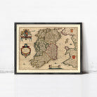 The image is a framed antique map of Ireland, featuring detailed cartography and illustrations.