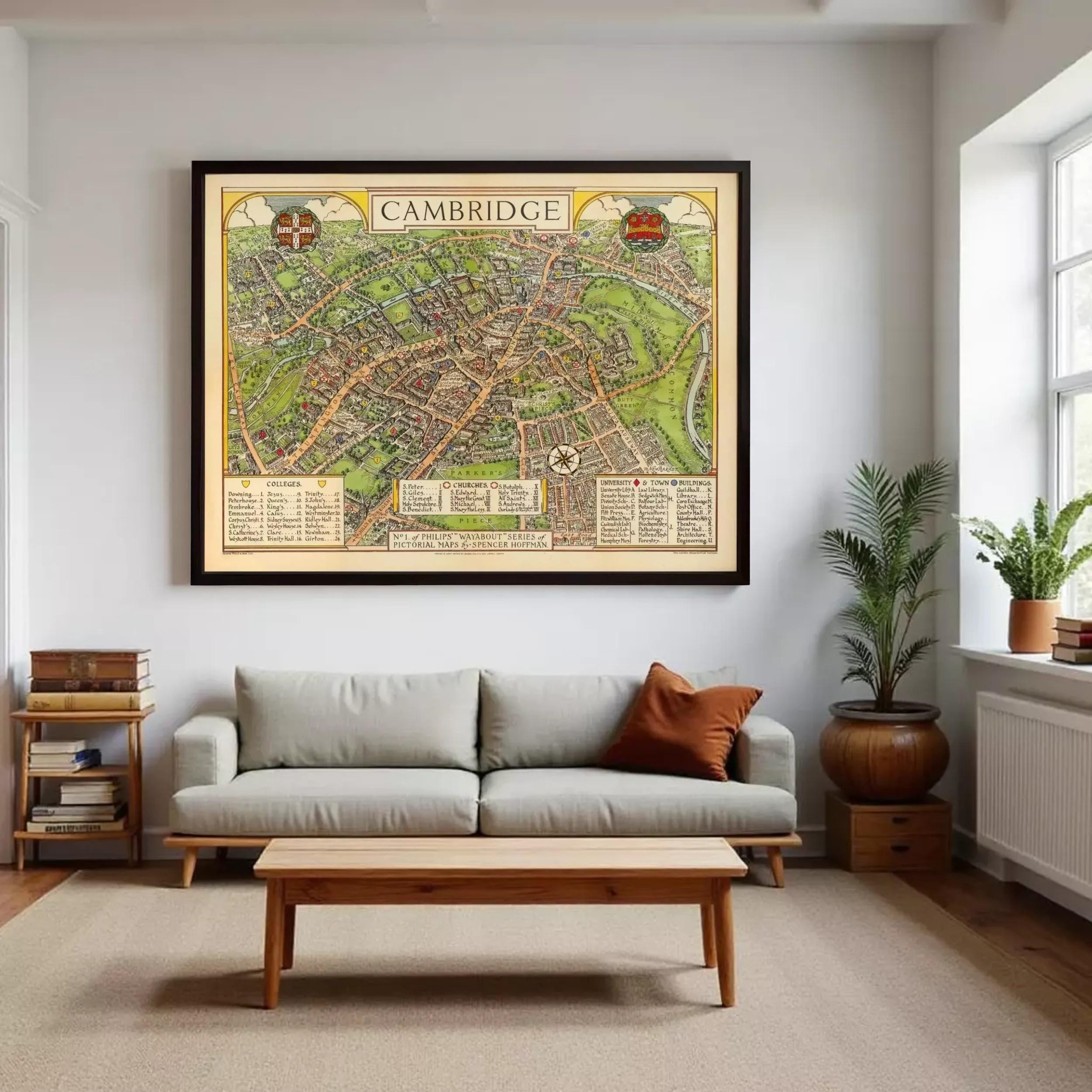 A large framed map of Cambridge, England, hanging on a wall in a living room.
