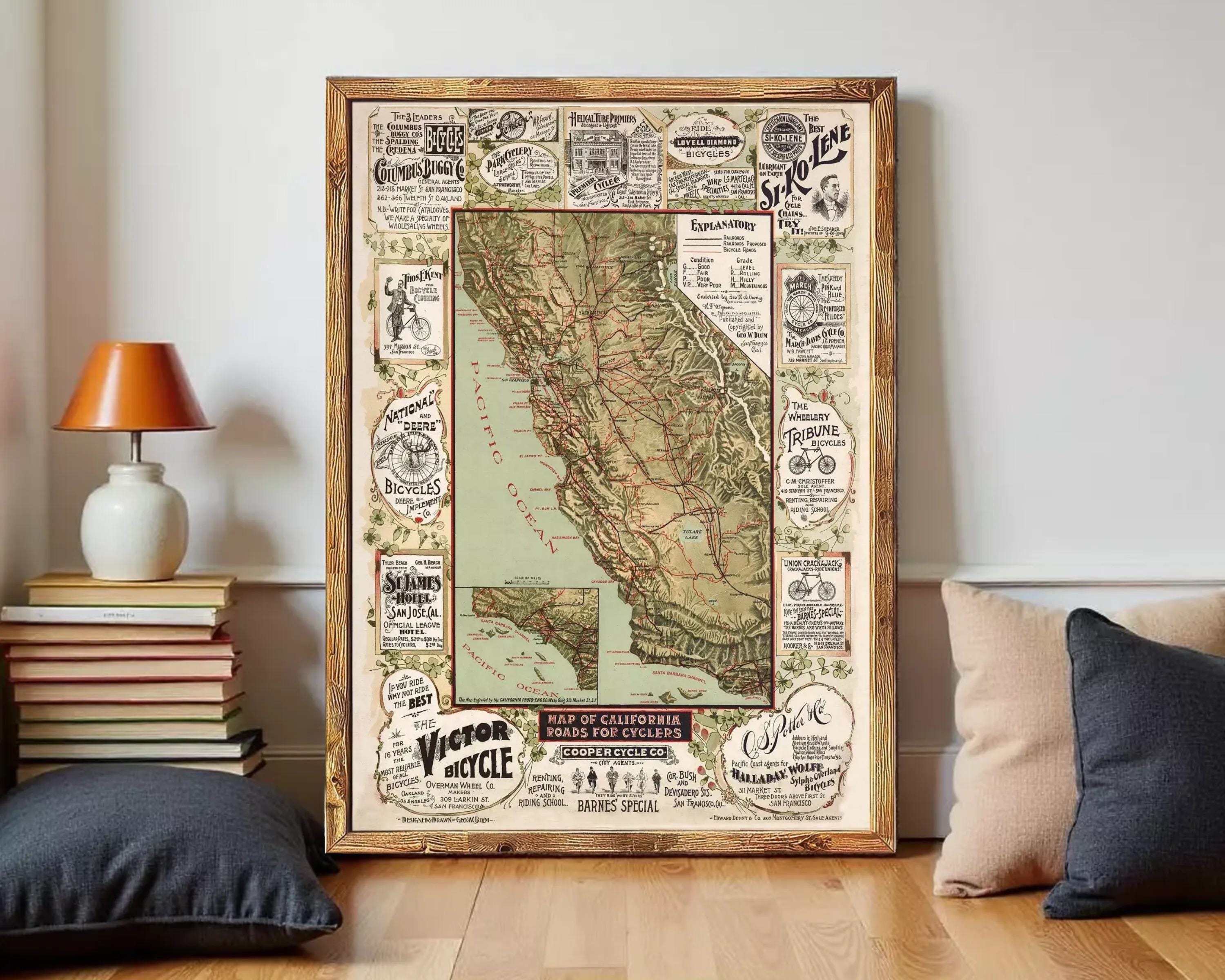 The image is a framed vintage map of California, featuring various advertisements and illustrations related to cycling and transportation.