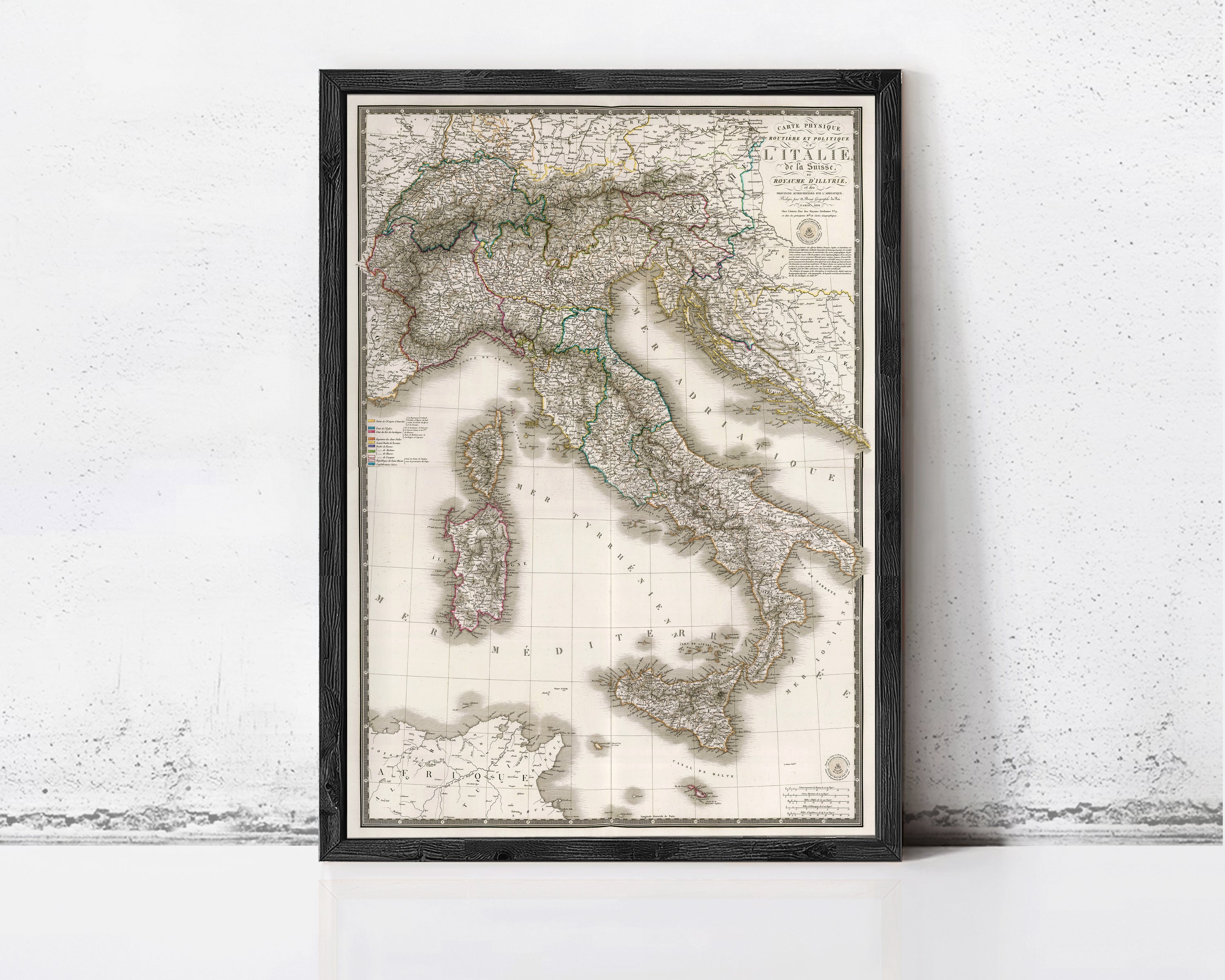 The image is a framed map of Italy, showing the country's geographical layout and surrounding areas.