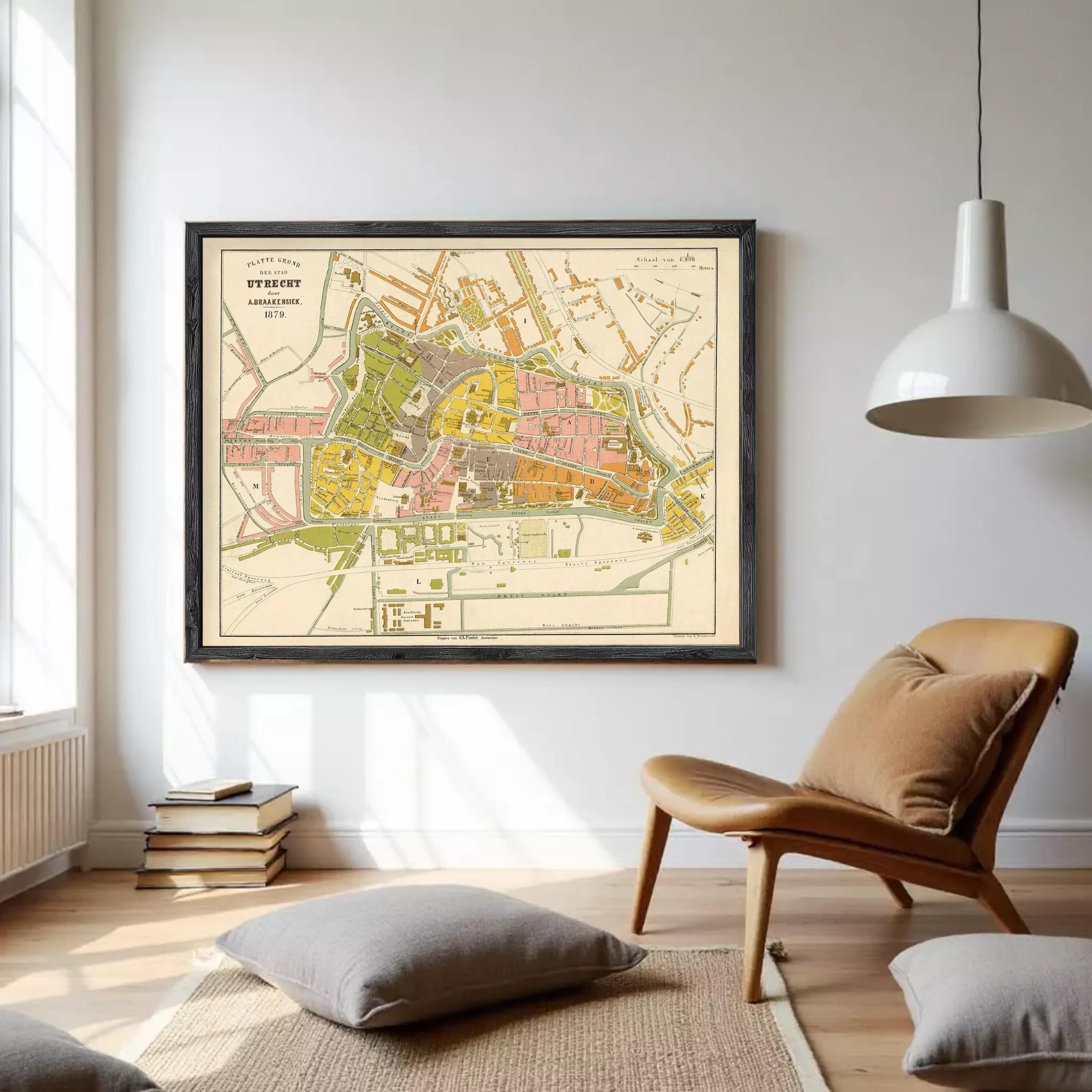 The image is a framed vintage map of a city, likely from the 19th century, depicting the layout and streets of the area.