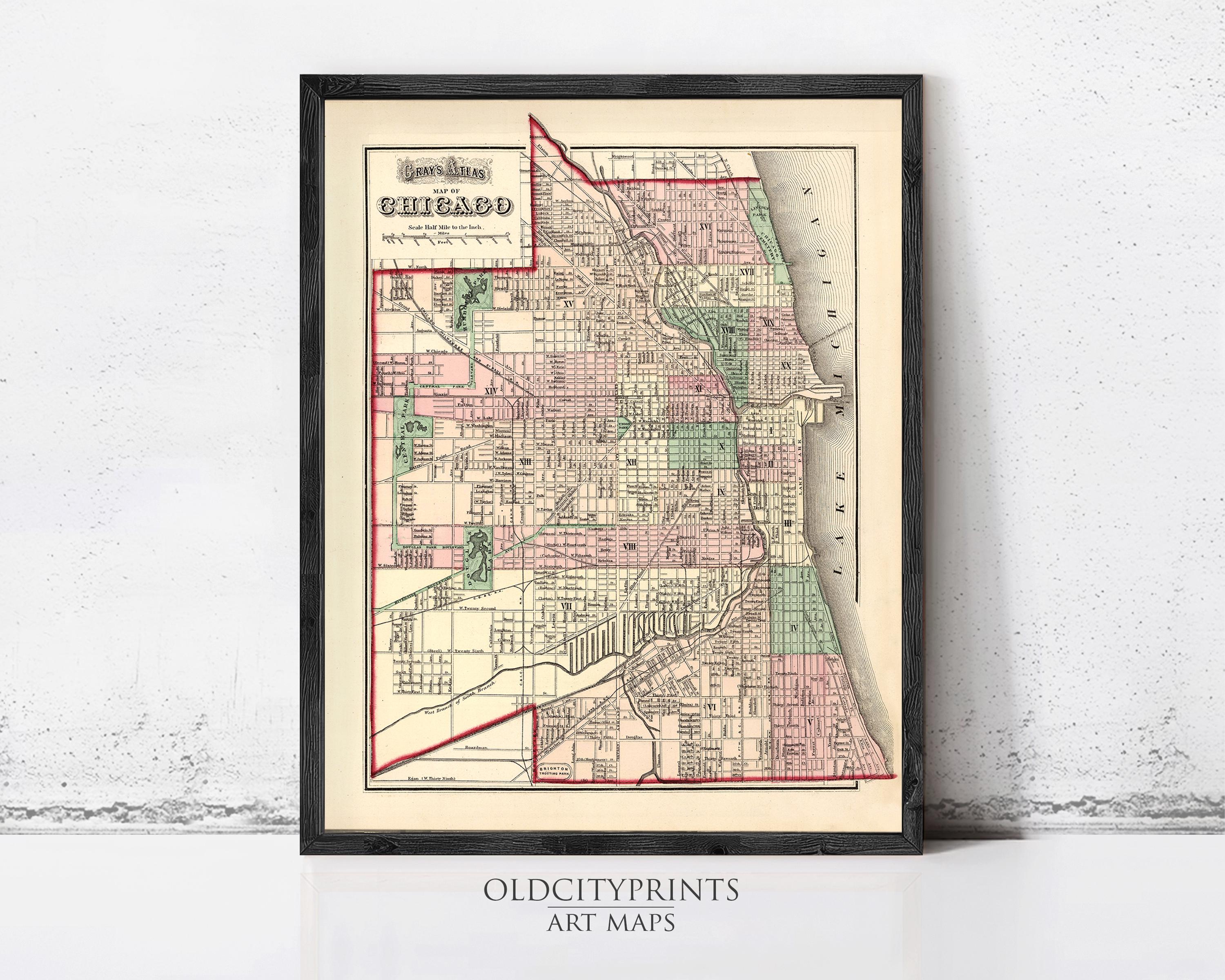A framed vintage map of Chicago, Illinois, with a detailed and colorful depiction of the city's streets and neighborhoods.