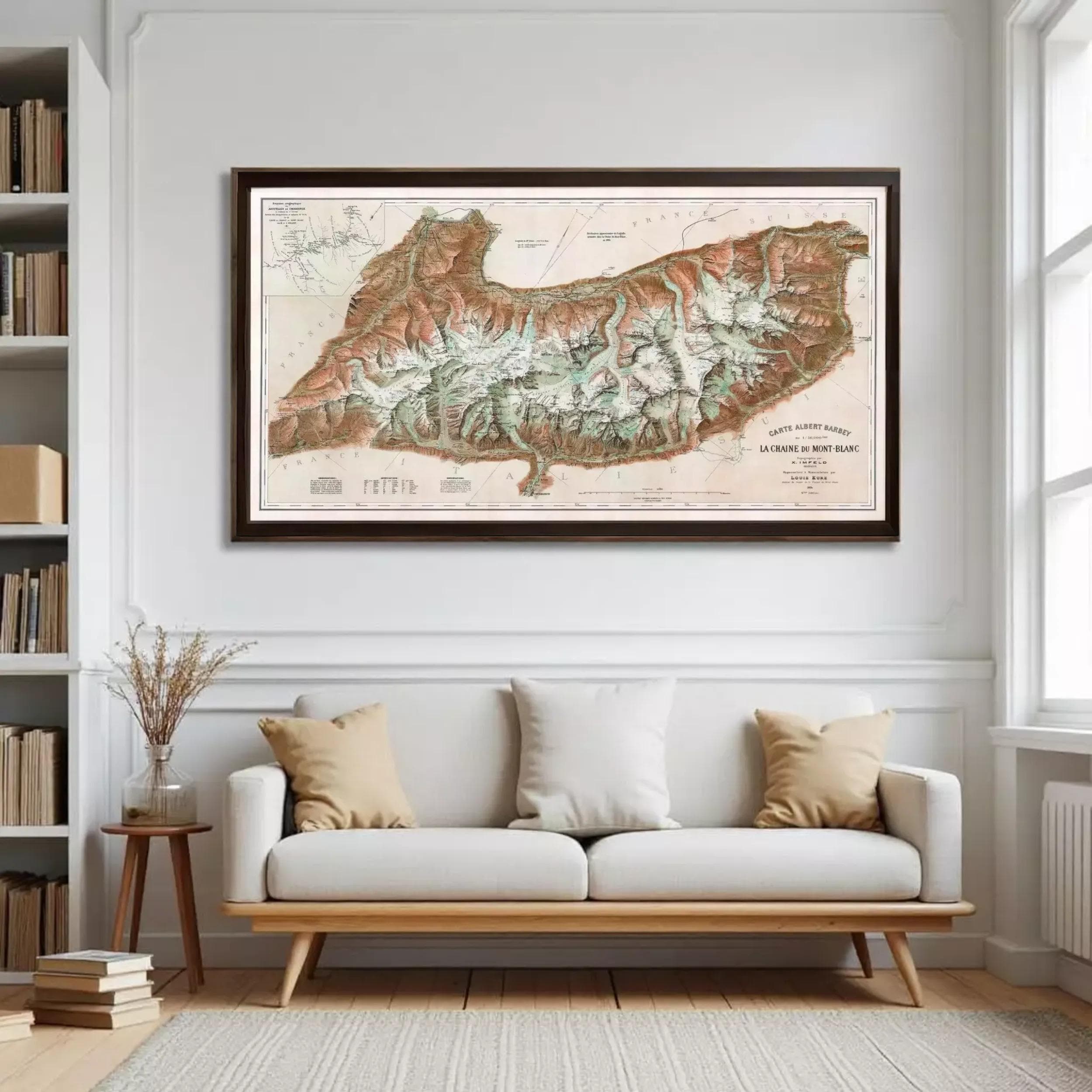 a large framed map of a mountainous region hanging on a wall in a living room.