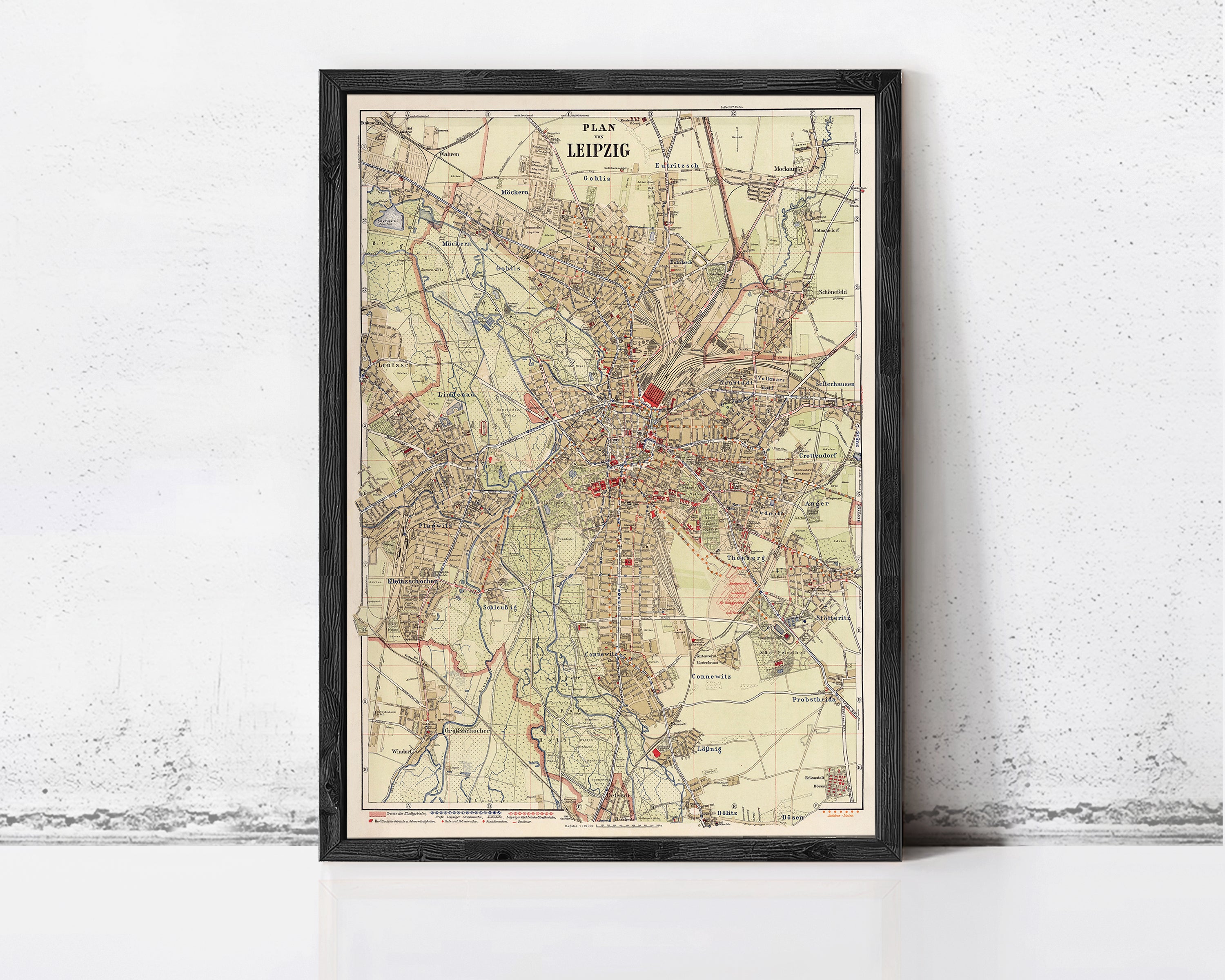 The image is a framed vintage map of Leipzig, Germany, depicting the city's layout and surrounding areas.