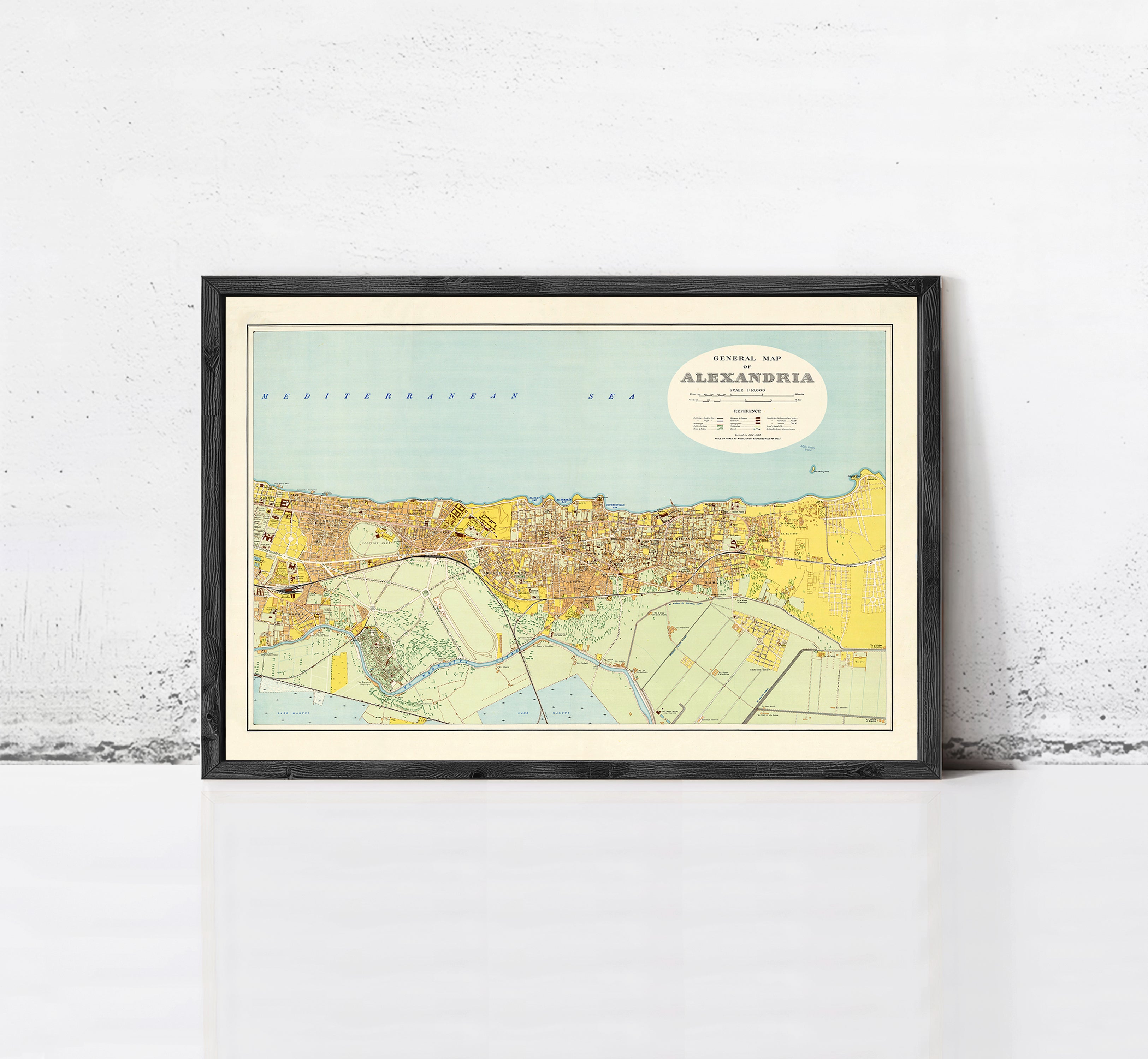 The image is a framed map of the city of Moscow, Russia, depicting the city's streets, landmarks, and surrounding areas.