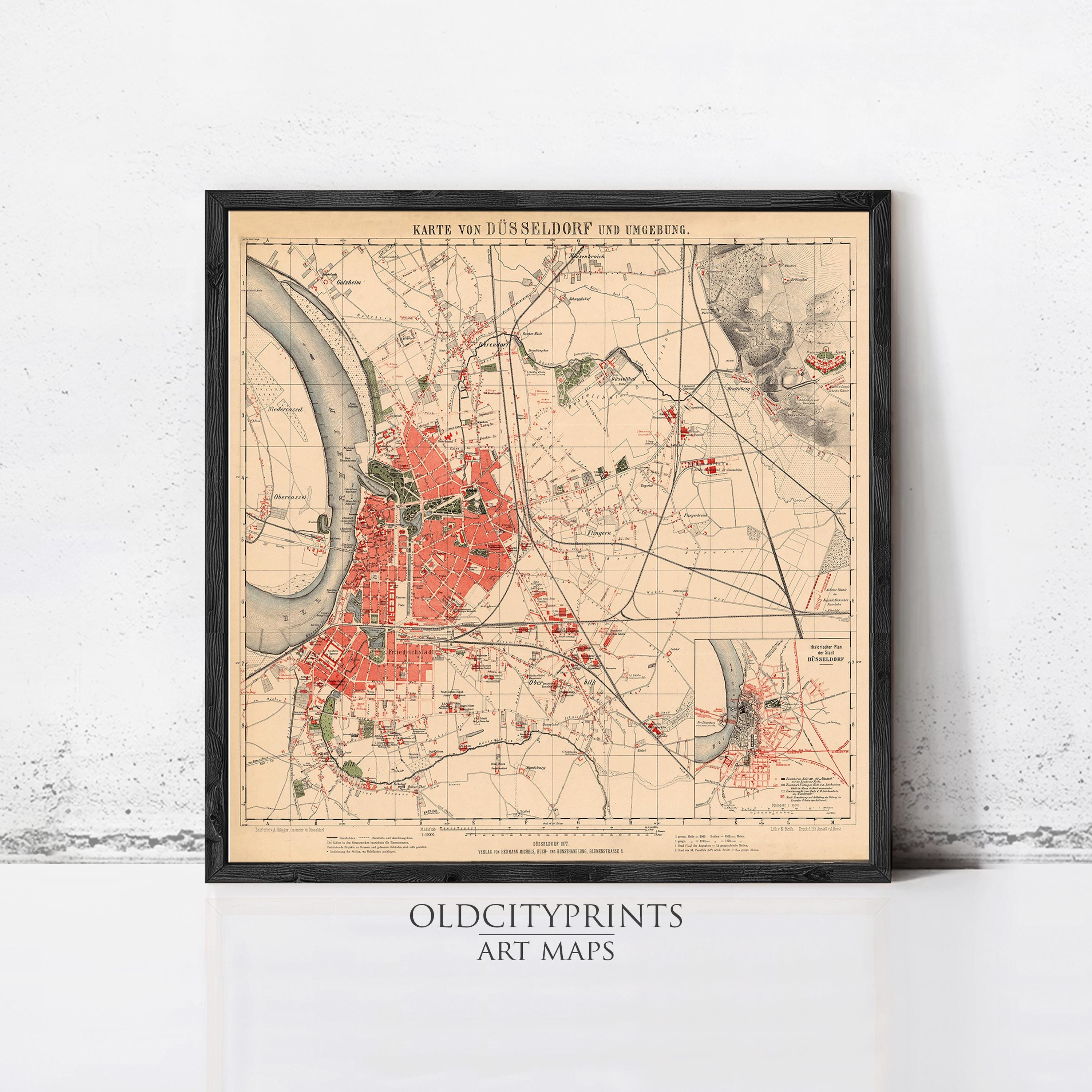 The image is a framed vintage map of Dusseldorf, Germany, depicting the city's layout and surrounding areas.