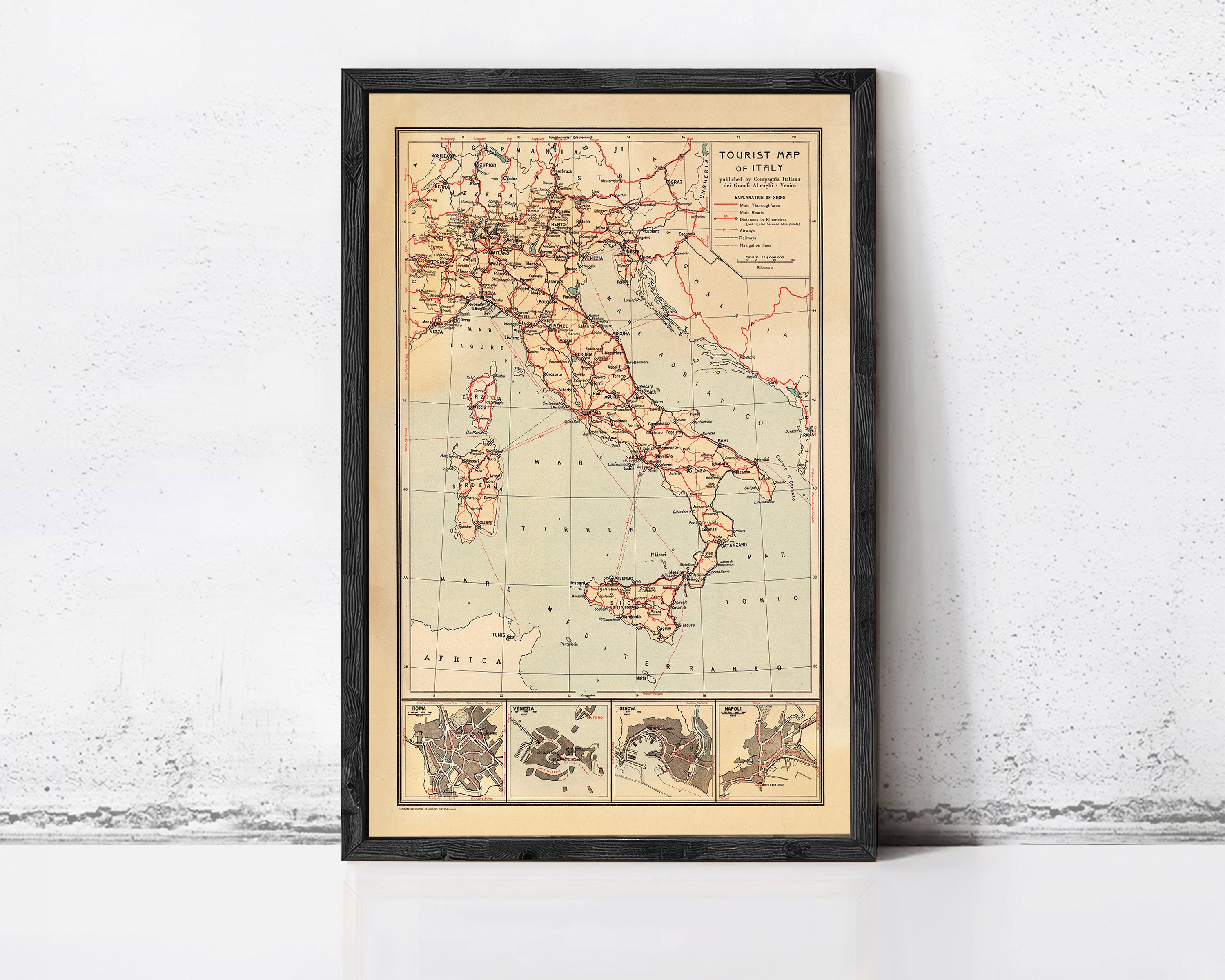 The image is a framed vintage map of Italy, showing the country's geographical layout and surrounding areas.