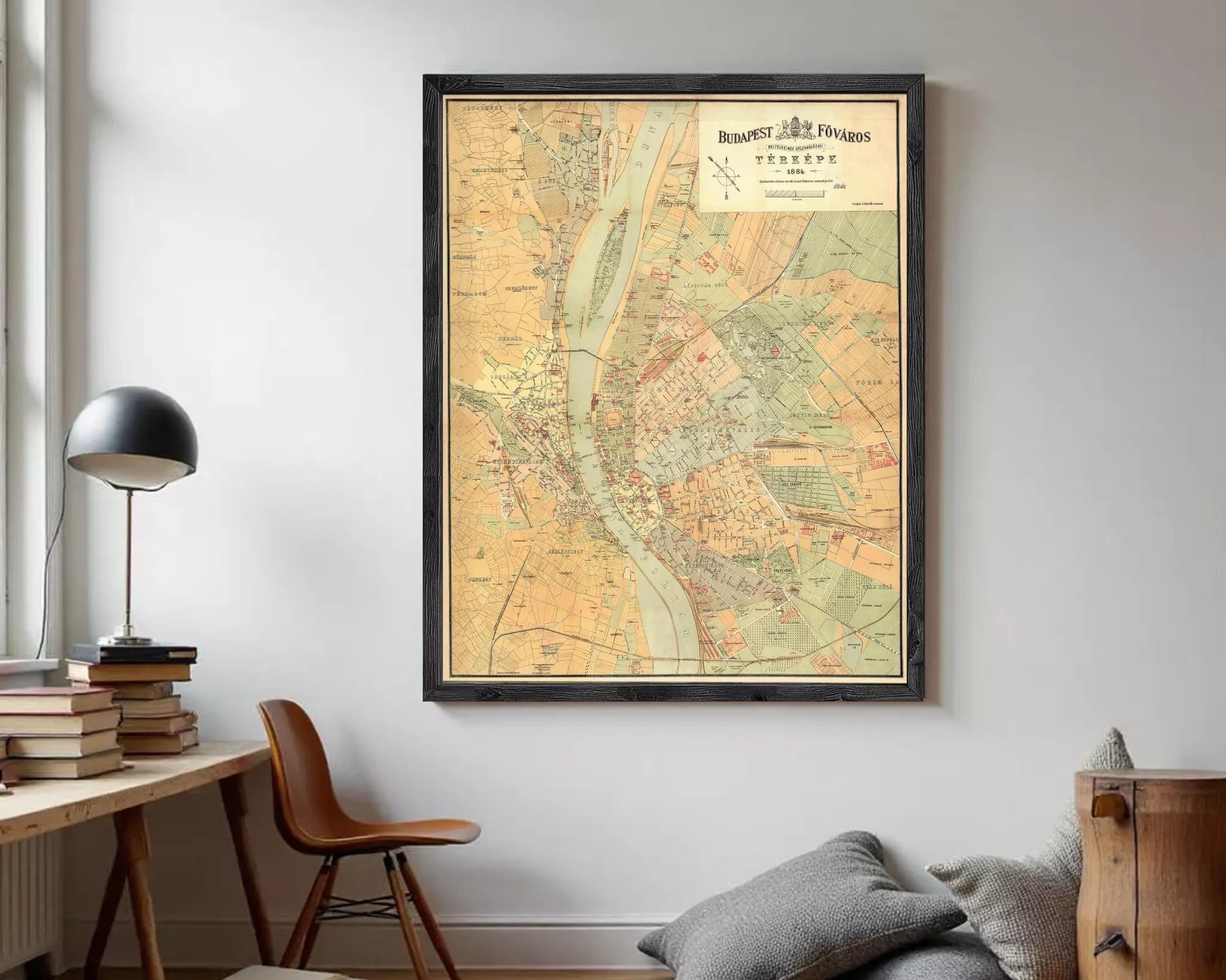 The image is a framed vintage map of Budapest, Hungary, depicting the city's streets and surrounding areas.