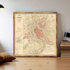 The image is a vintage map of the city of Besancon, France, with various colored lines and symbols representing different geographical features and locations.
