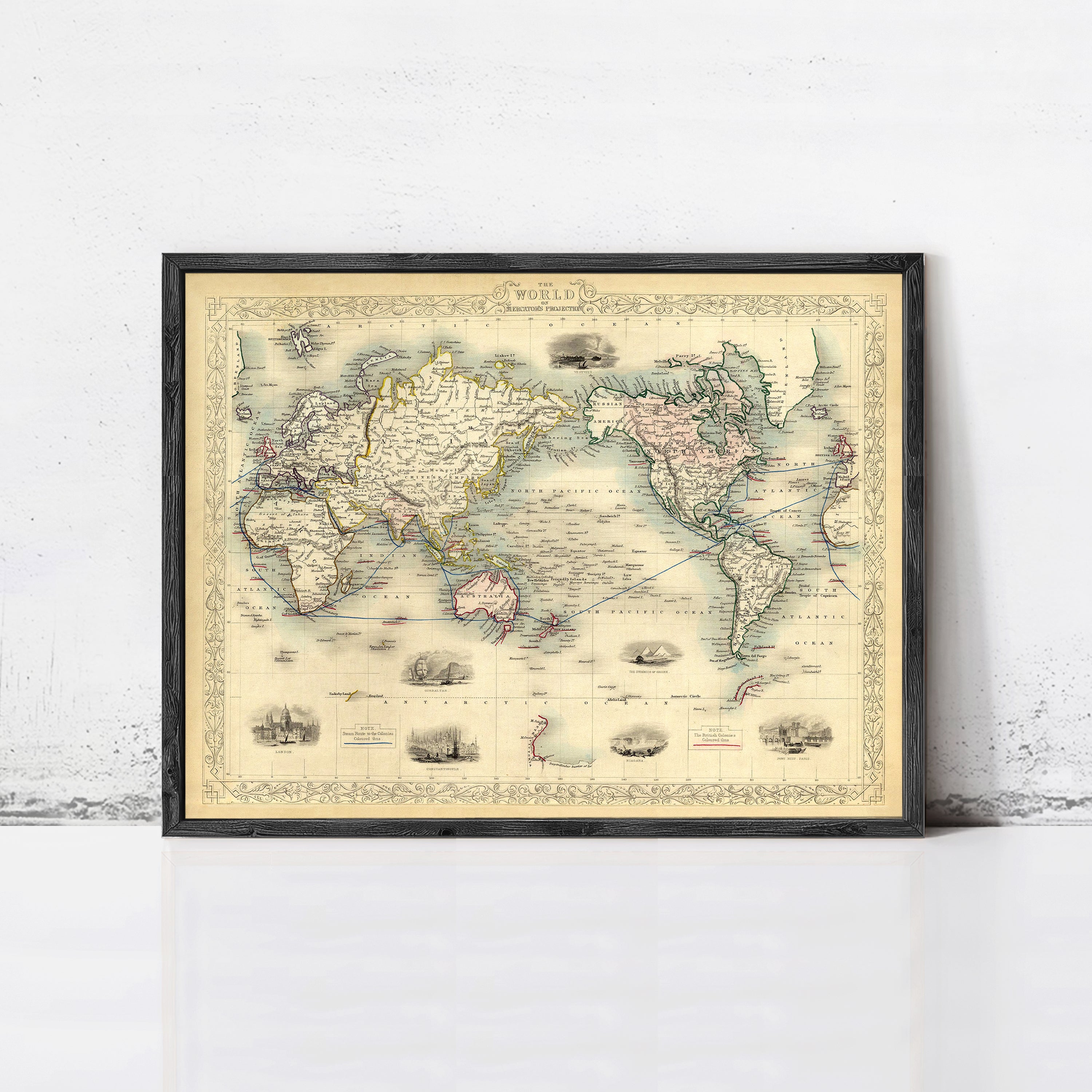 The image is a framed vintage world map depicting the continents and oceans in a detailed and intricate manner.