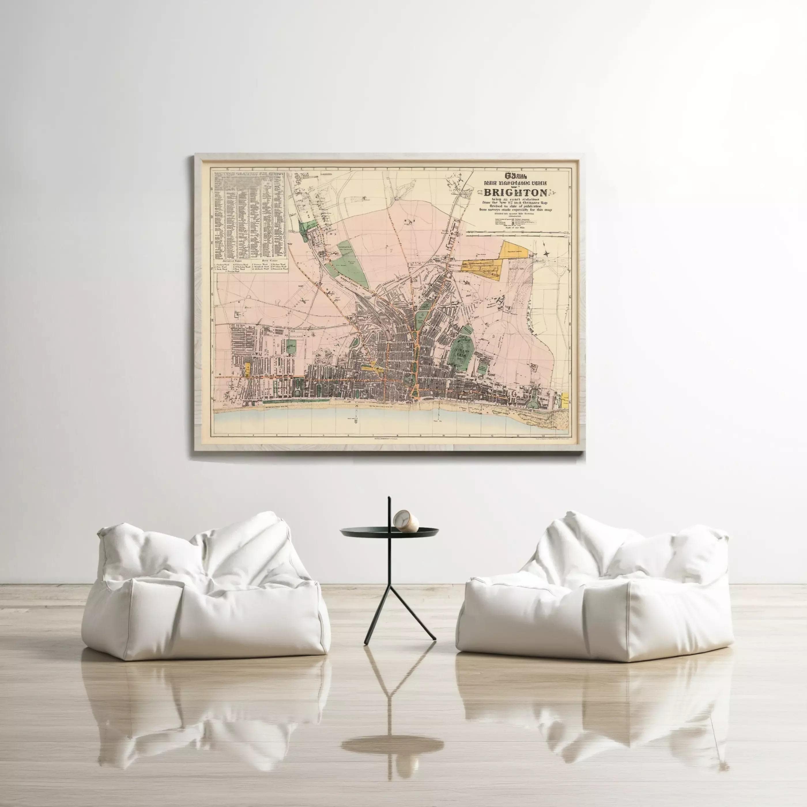 a large framed map of Brighton, with two white bean bag chairs positioned in front of it, creating a cozy and inviting atmosphere.