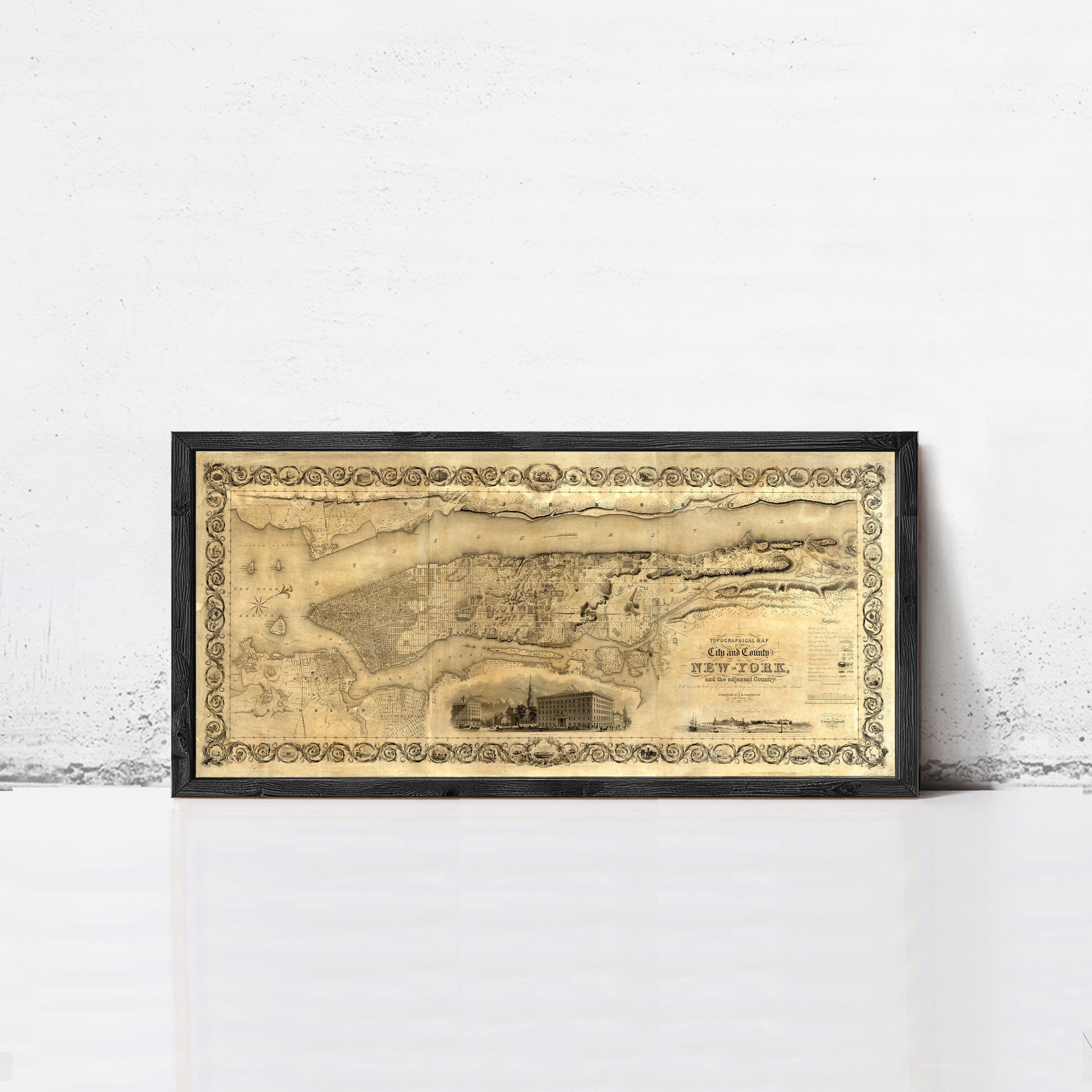 The image is a framed antique map of New York, depicting a detailed layout of the city.