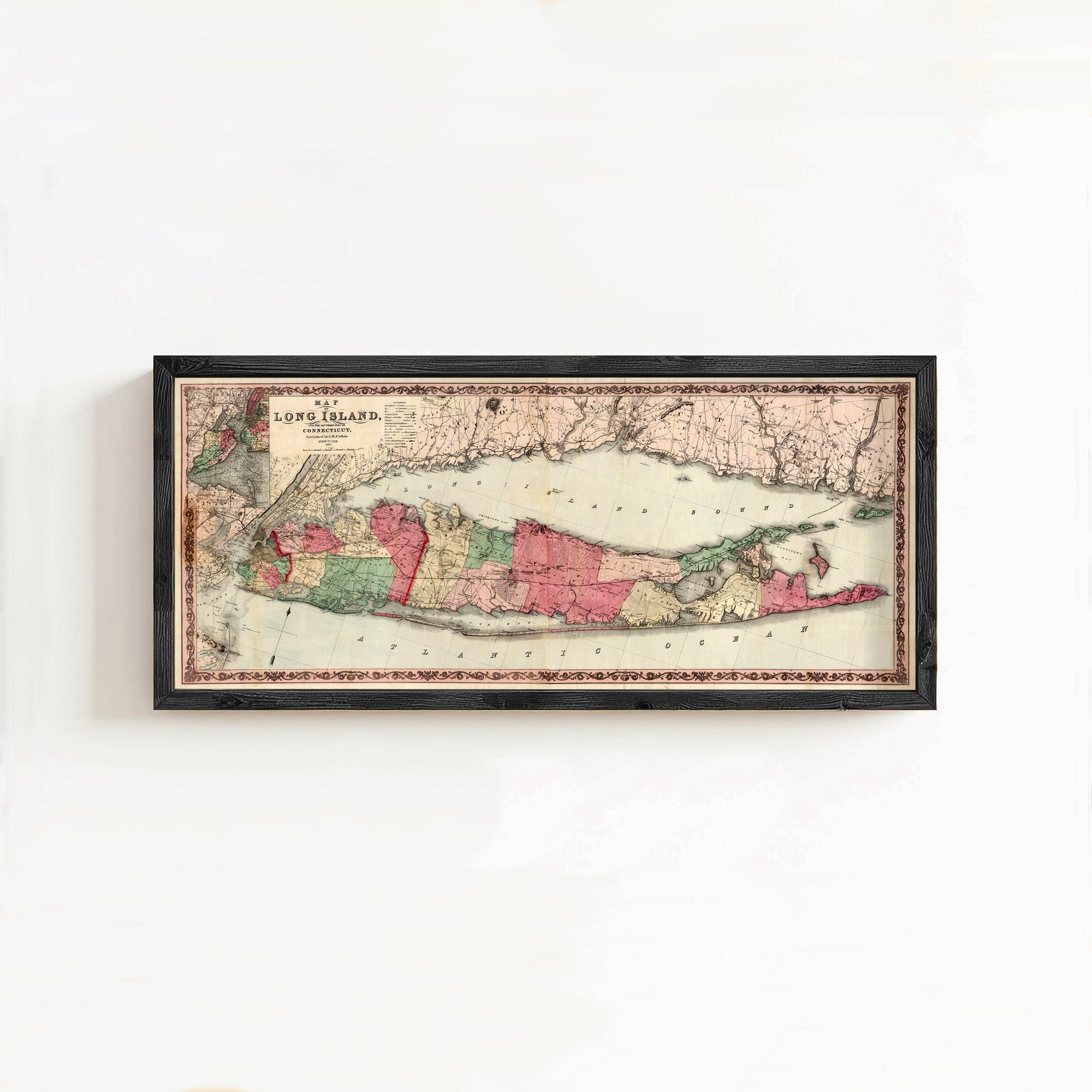 A framed map of Long Island, New York, with the island's borders and surrounding areas clearly visible.