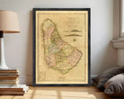 The image is a framed vintage map of Barbados, showing the country's geographical layout and boundaries.