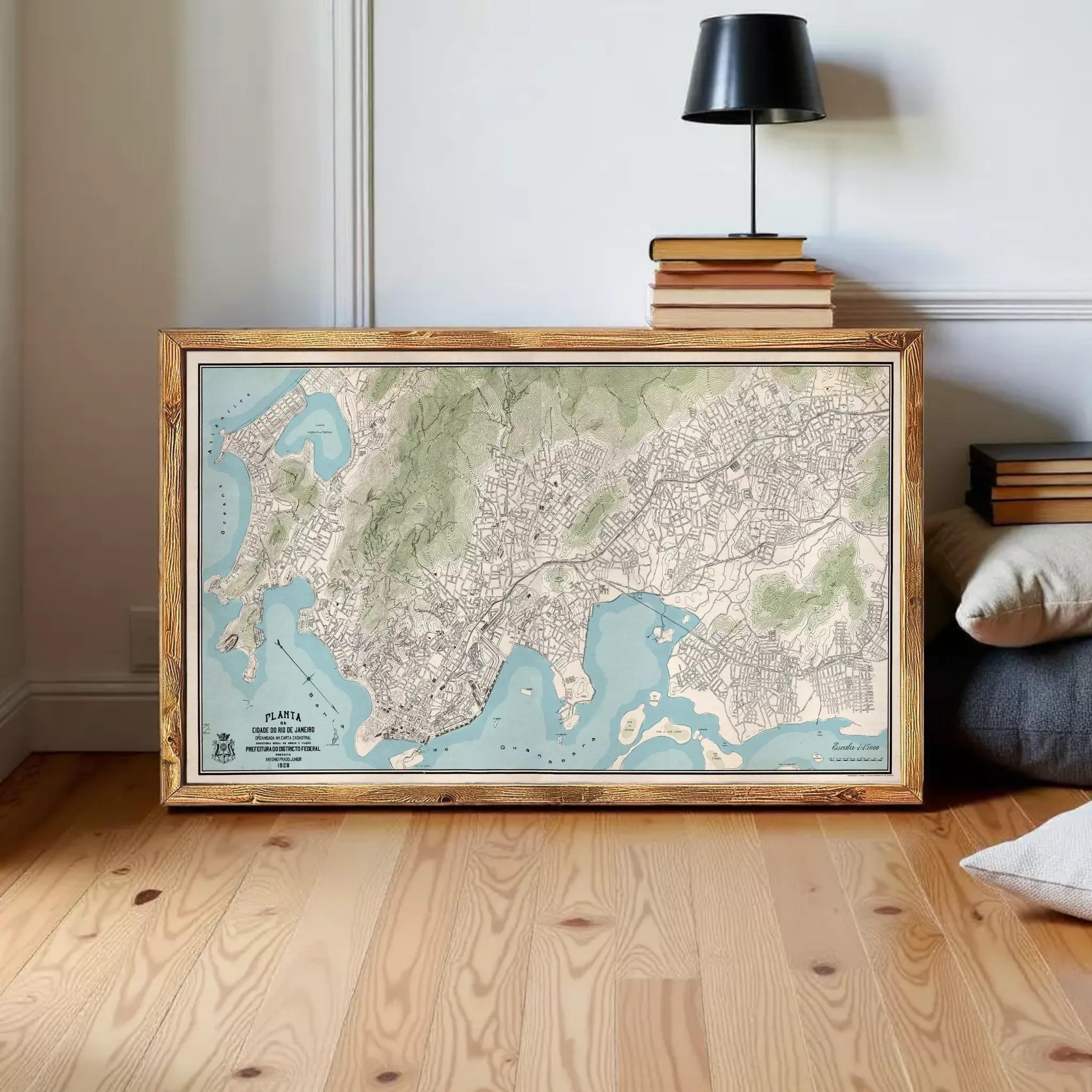 a large framed map of a city or region, with a wooden floor and a lamp in the background.