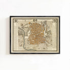 The image is a framed antique map of a city, likely from the 16th century, depicting a detailed layout of the city's streets, buildings, and other landmarks.