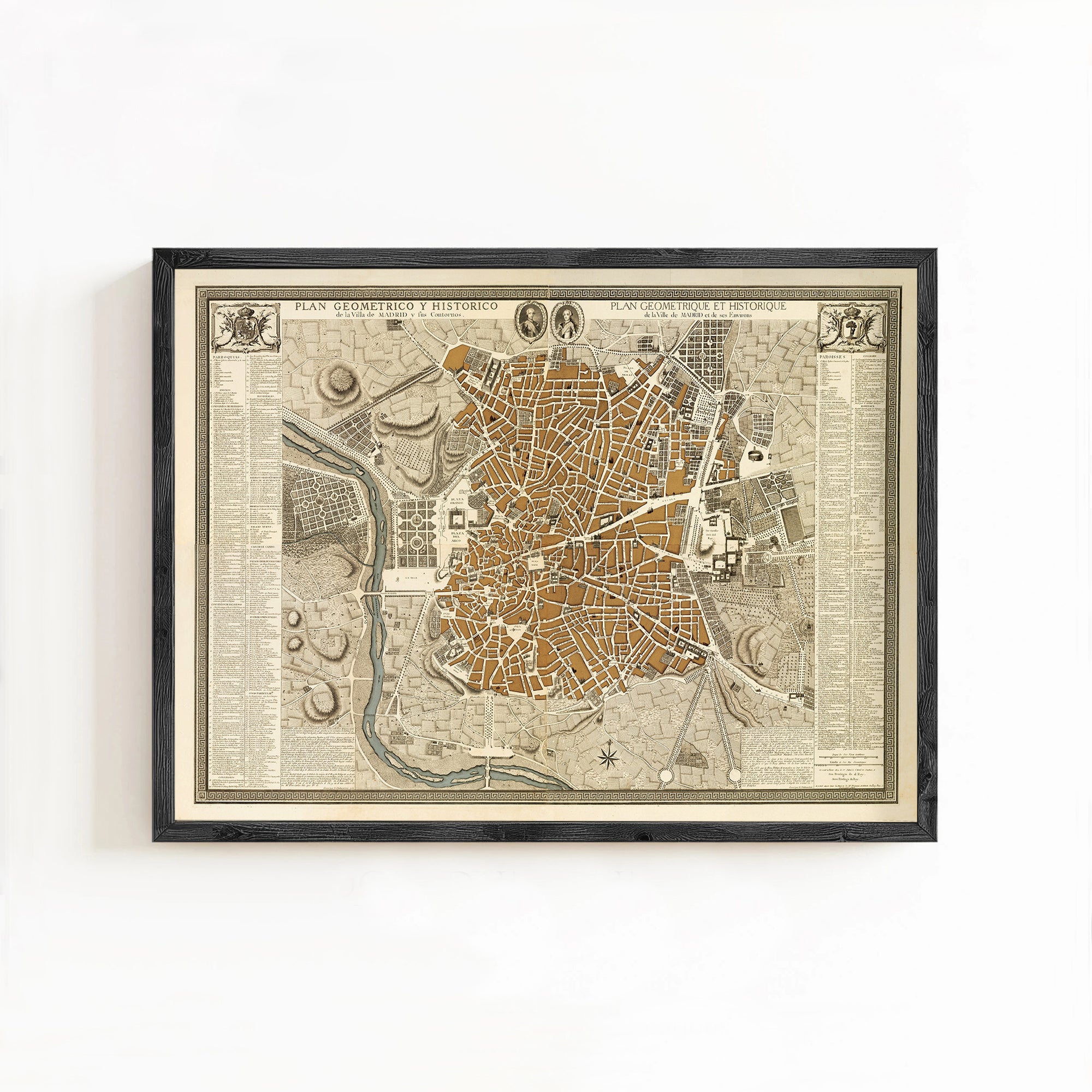 The image is a framed antique map of a city, likely from the 16th century, depicting a detailed layout of the city's streets, buildings, and other landmarks.