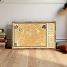 The image is a framed vintage map of a city, likely from the 19th century, displayed on a white wall.