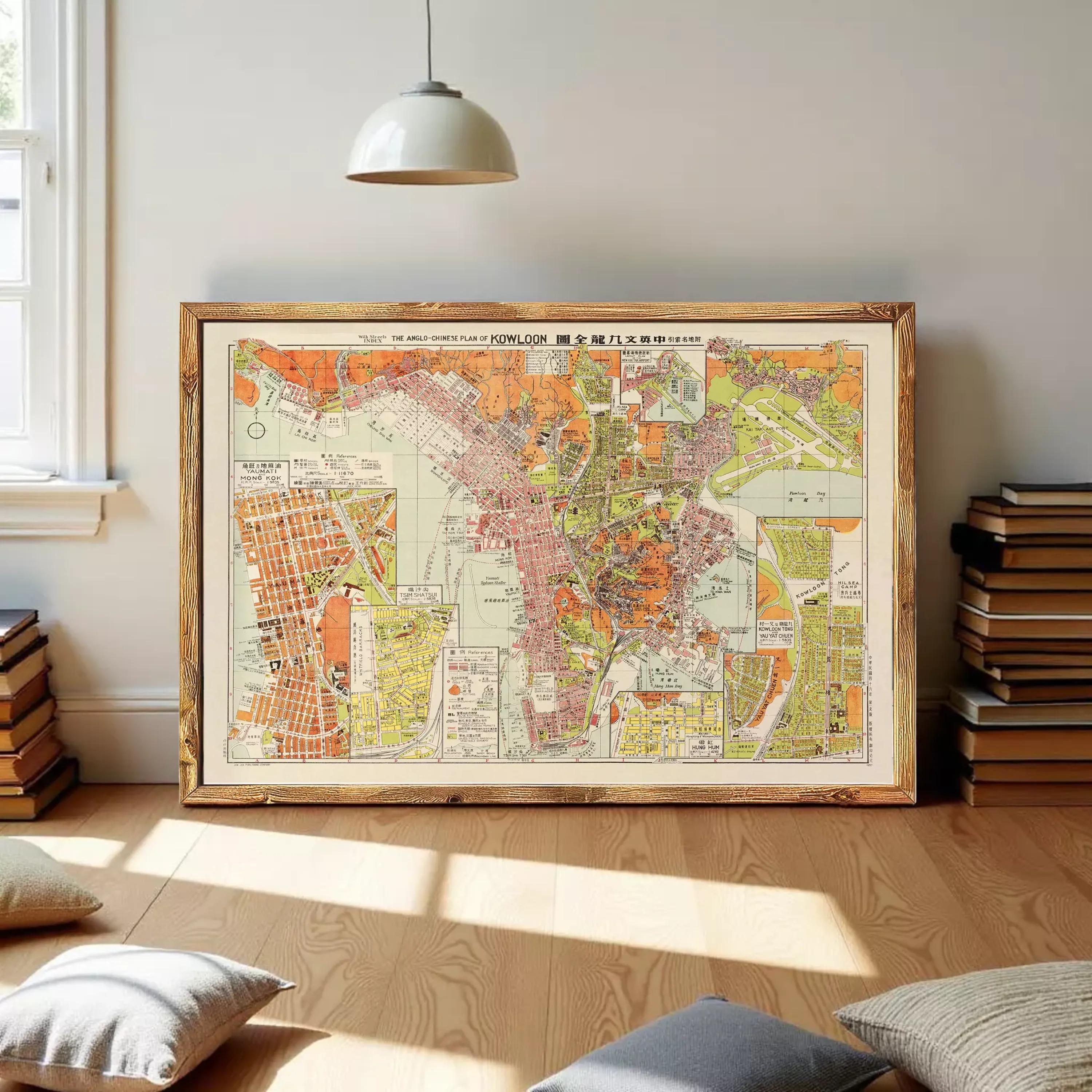 The image is a framed vintage map of a city, likely from the early 20th century, with a color palette of orange, green, and brown.