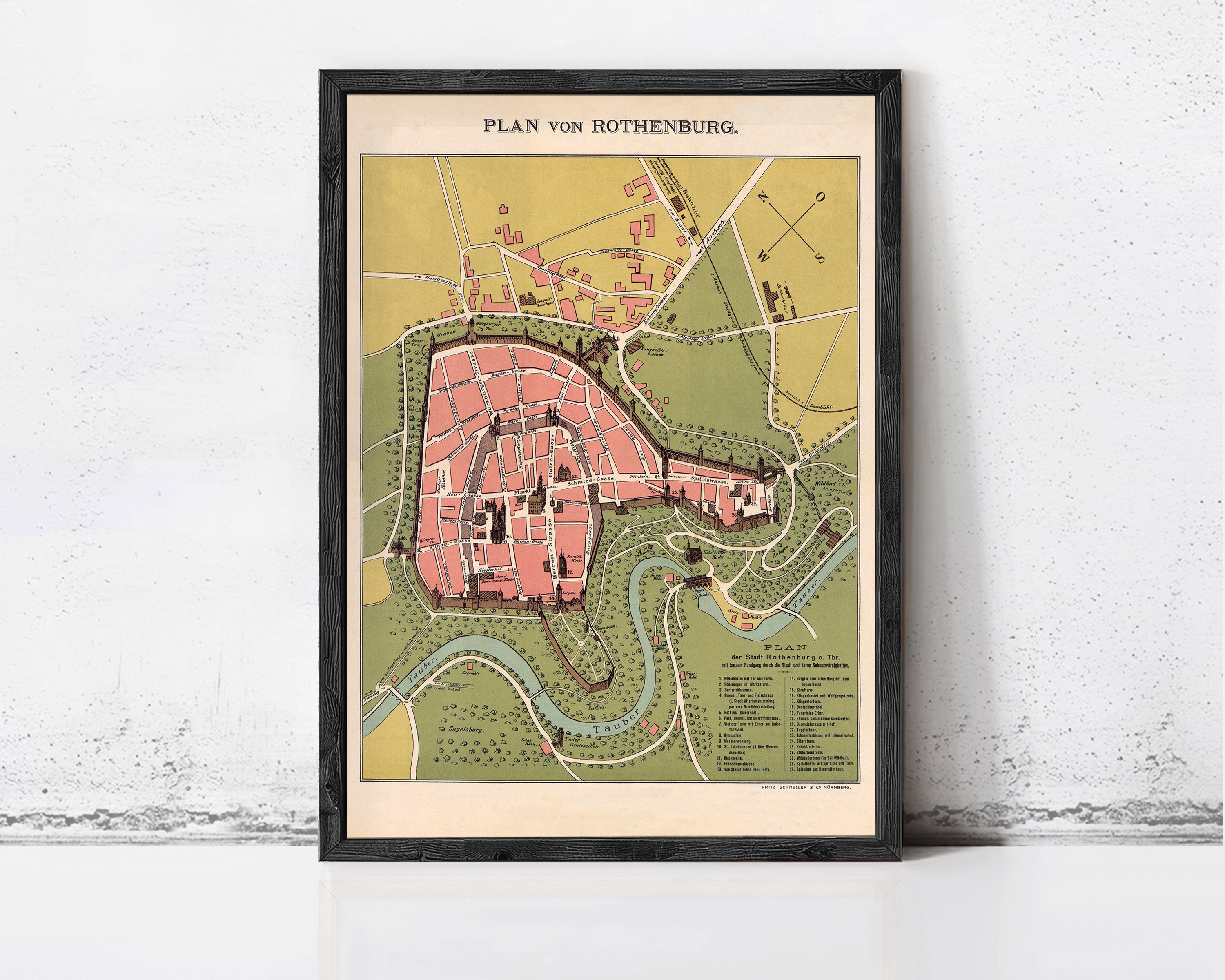 The image is a framed map of the city of Rothenburg, Germany, depicting the layout of the city and surrounding areas.