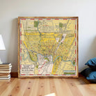 The image is a framed vintage map of the city of Winnipeg, Canada, depicting the city's streets, landmarks, and surrounding areas.