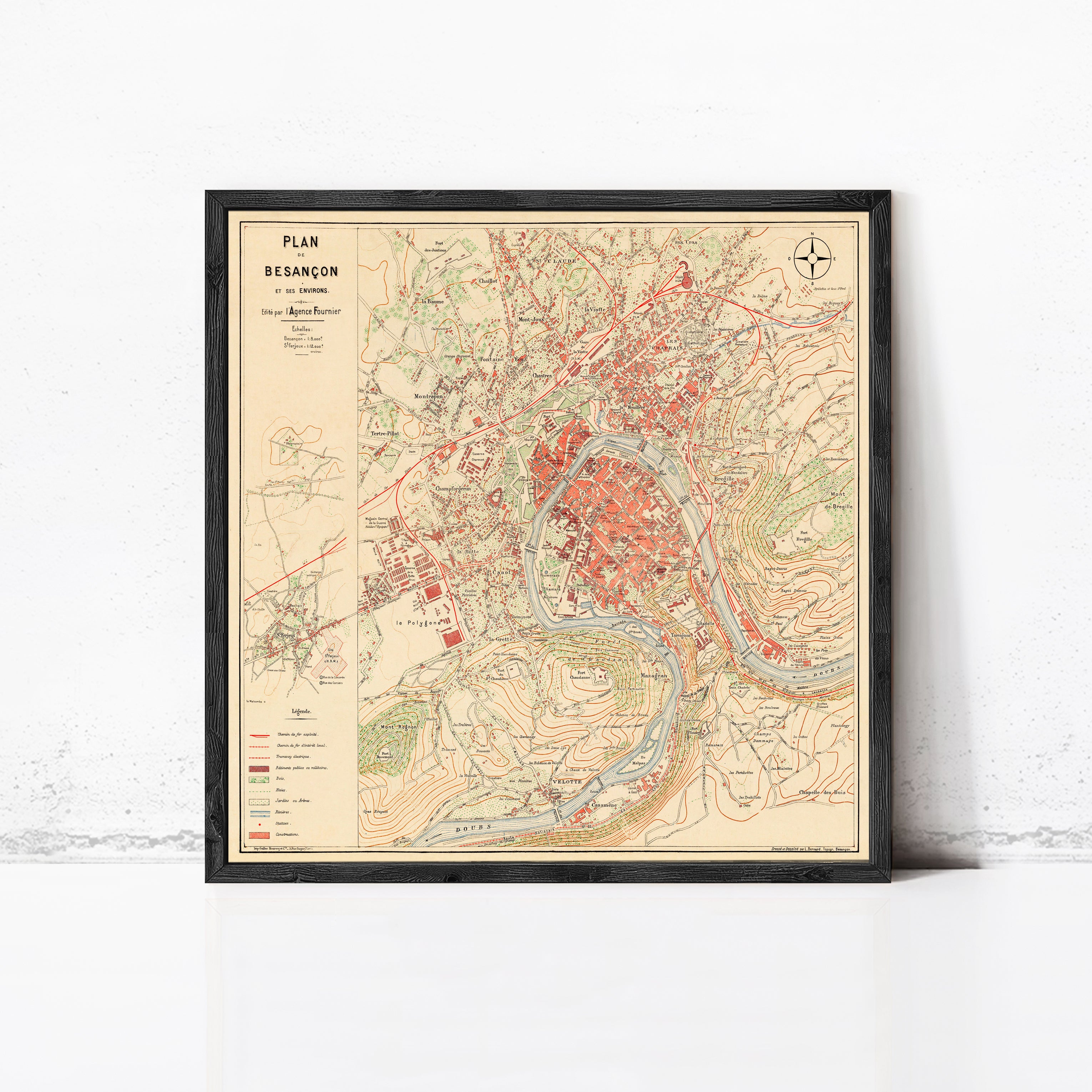 The image is a framed vintage map of the city of Besancon, showing various landmarks and geographical features.