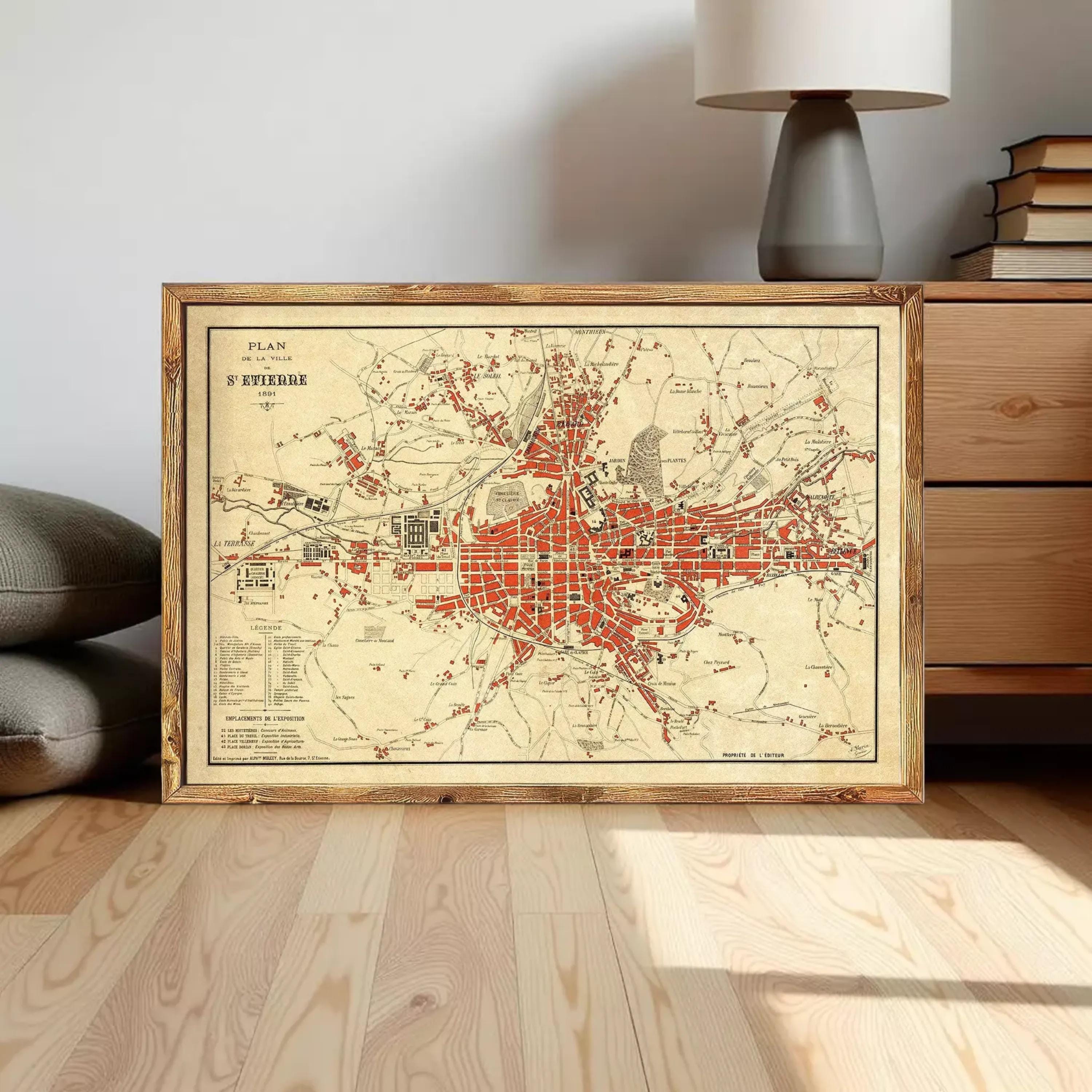 The image is a framed vintage map of a city, likely from the 19th century, with a detailed and intricate design.