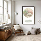 a cozy living room with a large framed map of Cincinnati hanging on the wall. The room is furnished with a wooden chair, a bookshelf, and a lamp. The overall atmosphere of the room is warm and inviting, with a focus on the map as the central decorative element.