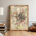 The image is a framed map of a city, likely Pittsburgh, with various colored areas representing different zones or neighborhoods.
