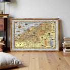 The image is a framed vintage map of Cleveland, Ohio, depicting various landmarks and locations within the city.