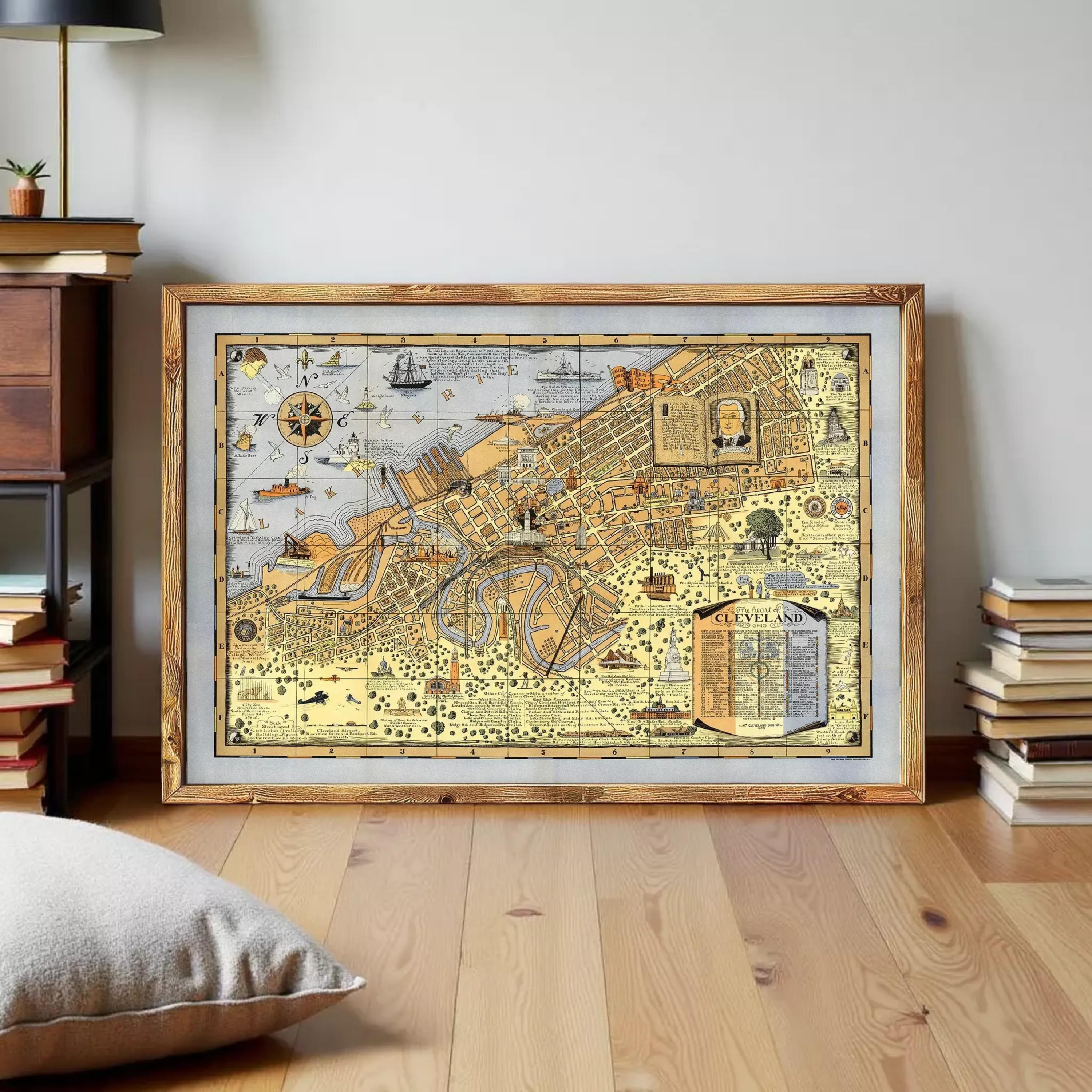 The image is a framed vintage map of Cleveland, Ohio, depicting various landmarks and locations within the city.