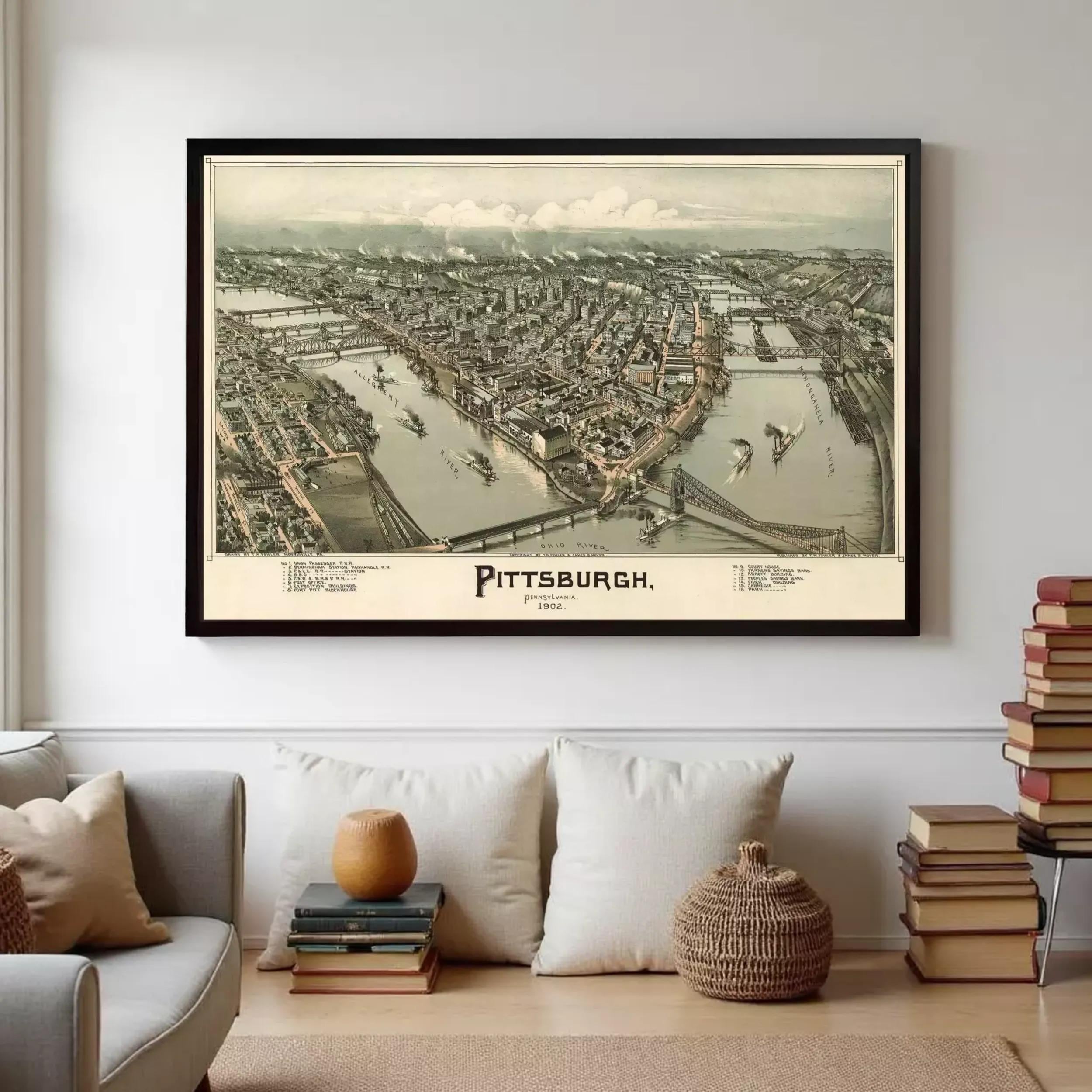 a large framed map of Pittsburgh, Pennsylvania, hanging on a wall in a living room setting.