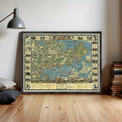 The image is a framed vintage map of the world, depicting various landmarks and locations.