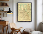 a large framed map of the United States hanging on a wall in a room with a wooden chair, a desk, and a bookshelf.