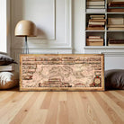 The image is a framed map of Europe, with a wooden frame and a vintage appearance.