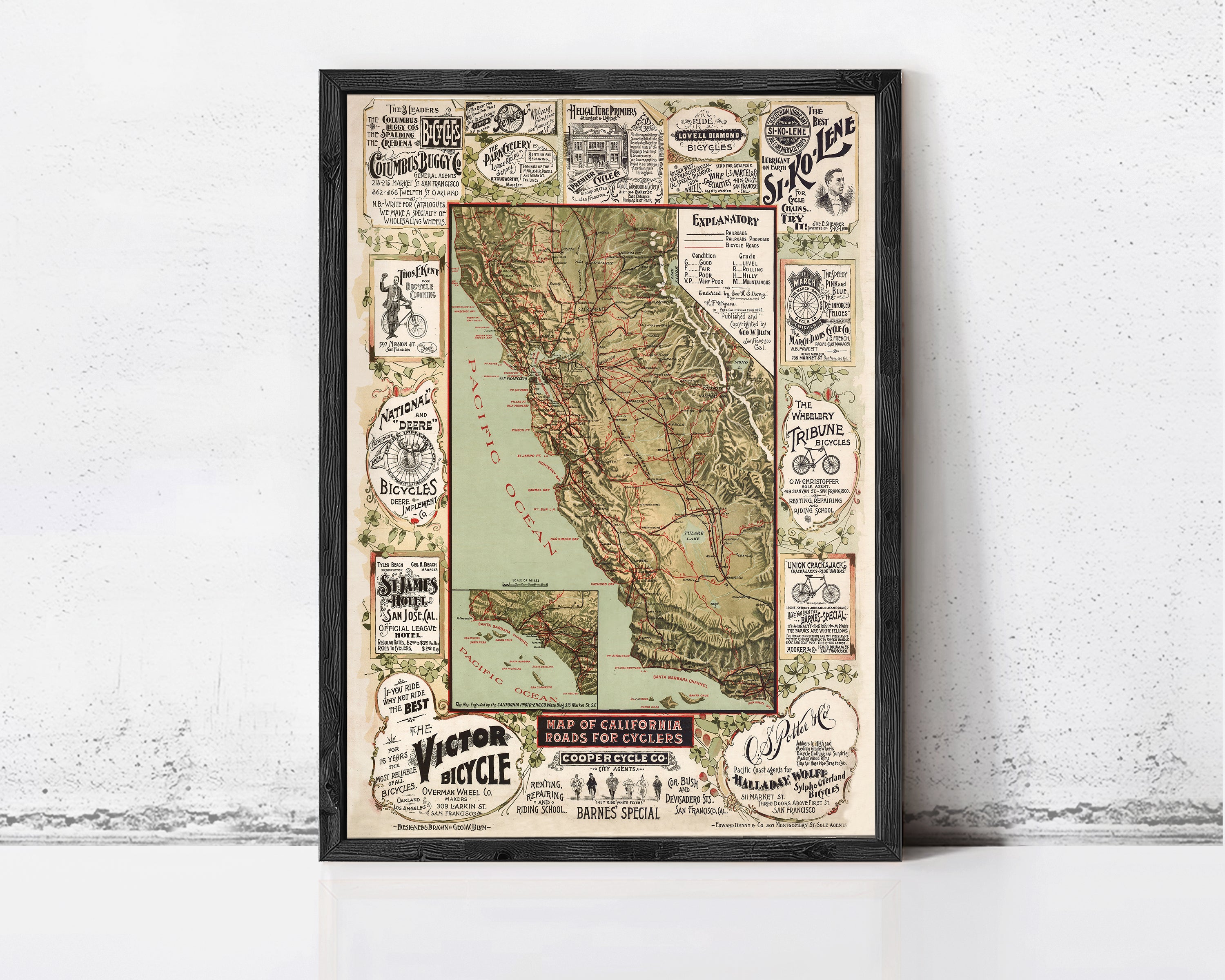 The image is a framed vintage map of California, featuring various advertisements and illustrations related to cycling and transportation.