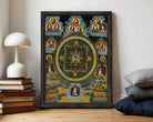 The image is a framed painting depicting a mandala with various figures and symbols surrounding it.