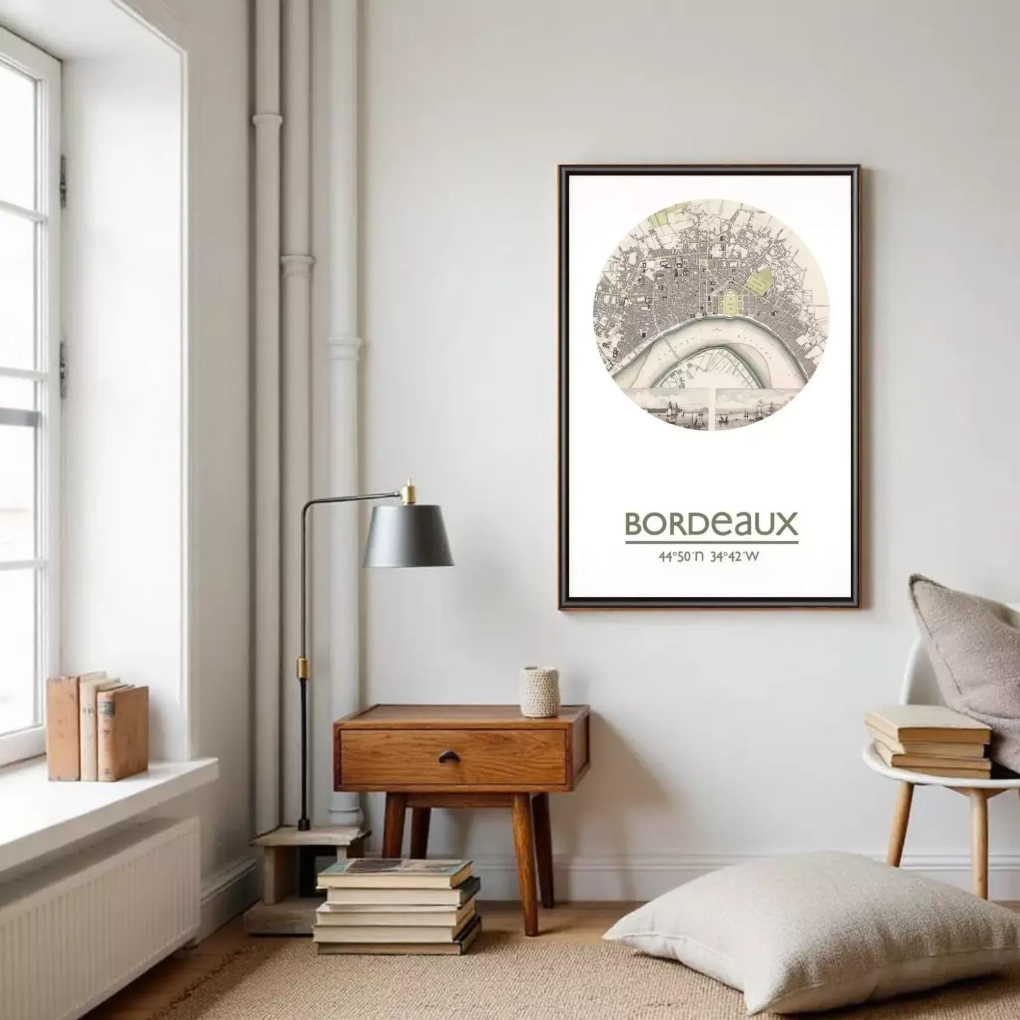 a cozy living room with a large framed print of a map hanging on the wall, a wooden side table, a lamp, and a stack of books.