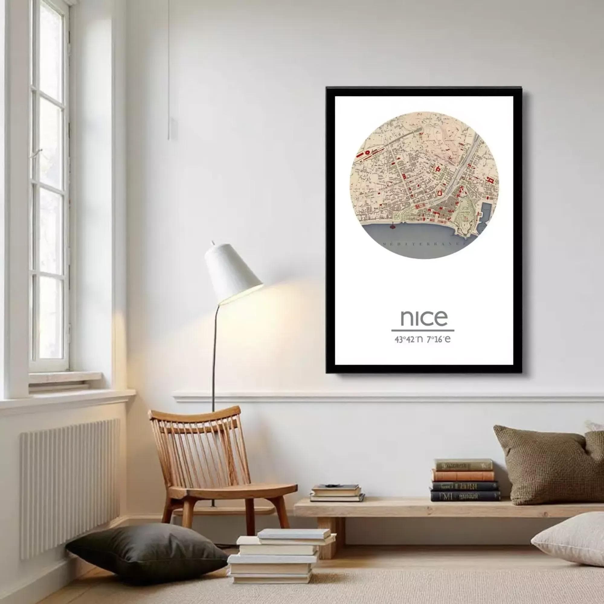 A framed map of Nice, France, with a circular design and a black border.