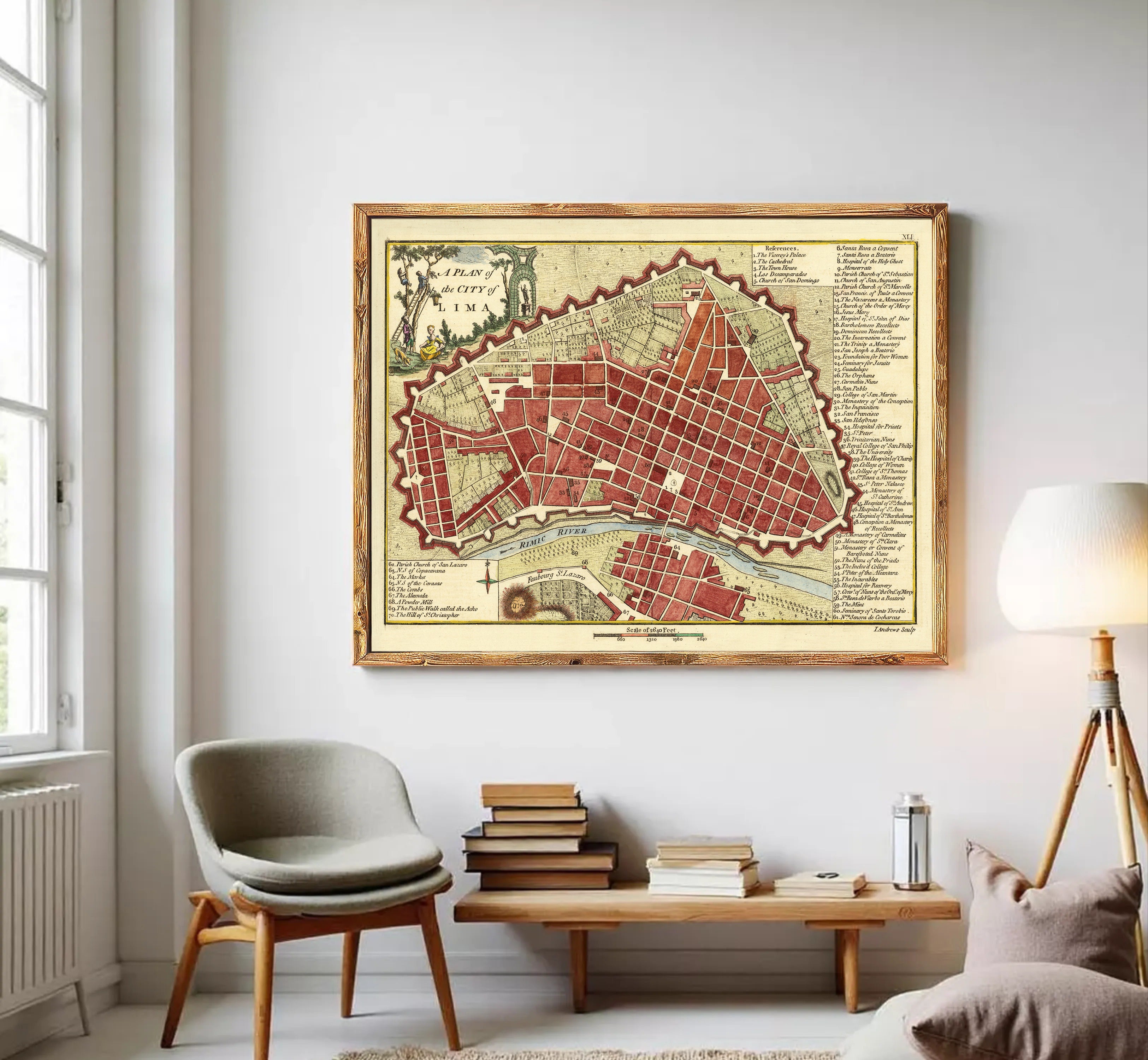 a large framed map of a city hanging on a wall in a living room.