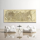 a large, antique map of the world displayed on the wall, with two white bean bag chairs positioned in front of it.