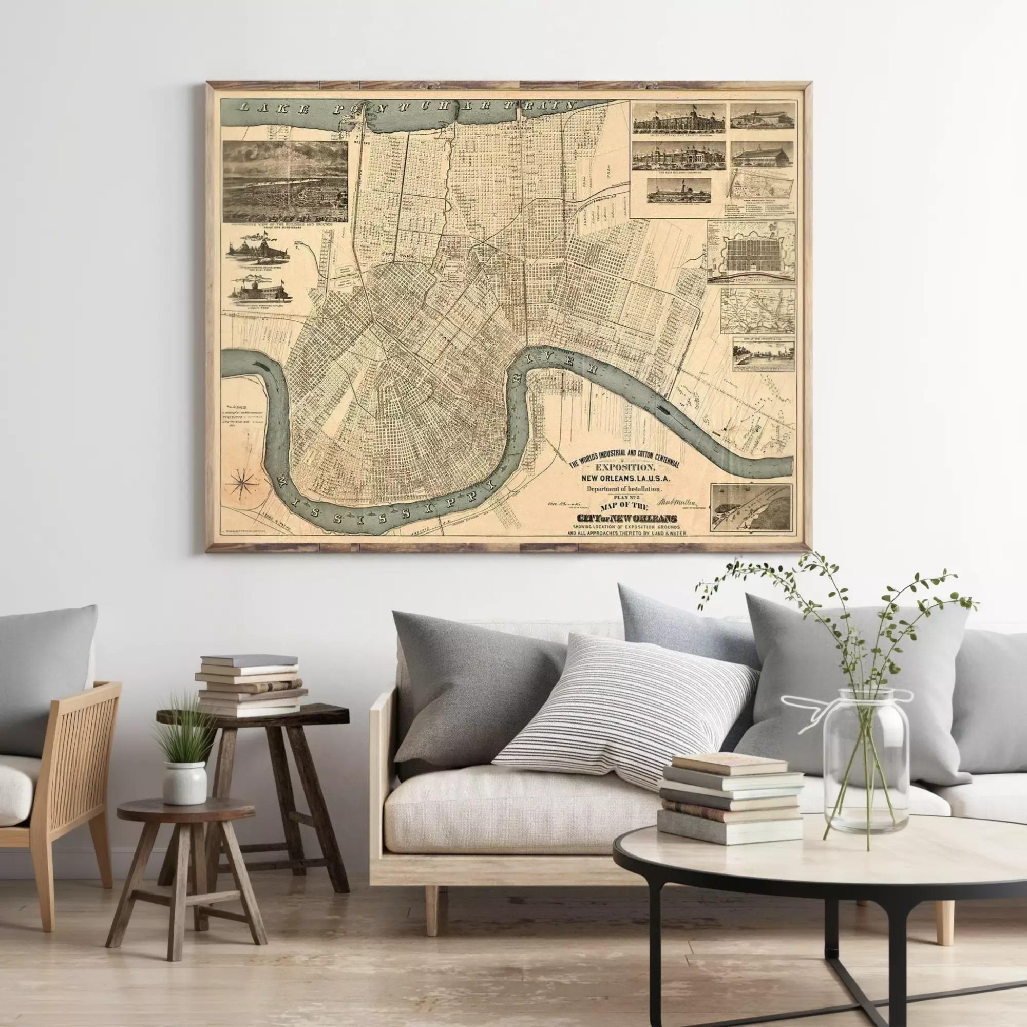 a large framed map of New Orleans, Louisiana, hanging on a wall above a living room with a couch, coffee table, and other furniture.