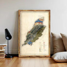 The image is a framed map of a region, likely depicting a mountainous area, with various colored regions representing different elevations or terrain types.