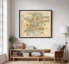 The image is a framed vintage map of a city, likely from the 19th century, depicting various landmarks and geographical features.