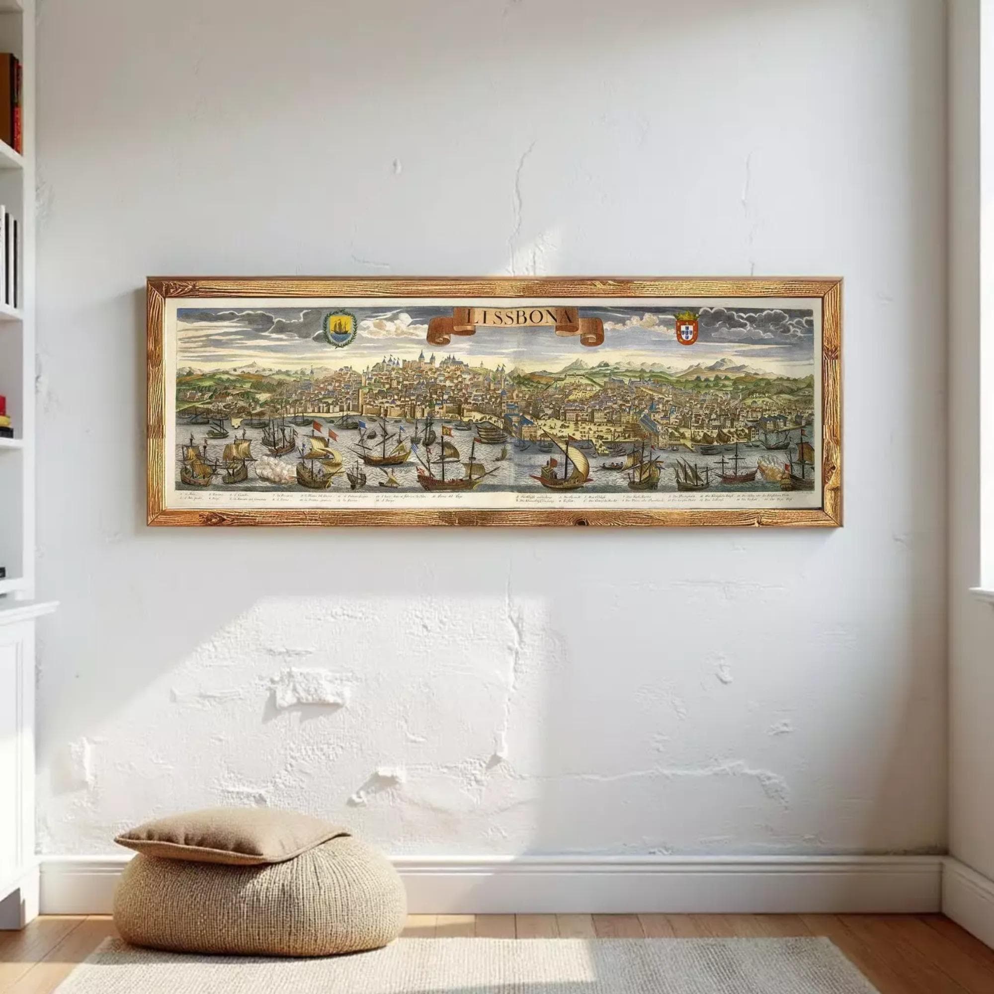 a large framed painting of a cityscape, hanging on a white wall.