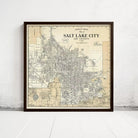 The image is a framed vintage map of Salt Lake City, Utah, depicting the city's streets and surrounding areas.