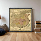 The image is a framed vintage map of China, depicting the country in a detailed and intricate manner.